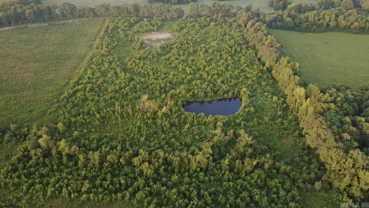 Escape to your own private retreat with this beautiful 20-acre property offering the perfect combination of improvements and natural beauty. Electricity is already on-site, and a large 100’ x 150’ pad has been prepared for your camper, RV, or future home. A drilled water well is located on the property (well pump and well house have not been installed), providing an excellent start toward your building plans. Enjoy peaceful mountain views, a scenic pond, and mature timber bordering one side of the property for added privacy and character. With plenty of room to build, hunt, explore, or simply relax, this versatile acreage offers endless possibilities. Whether you’re looking for a weekend getaway, future homesite, or investment property, much of the groundwork has already been completed. Don’t miss this opportunity to own a beautiful piece of the countryside with utilities already in place.