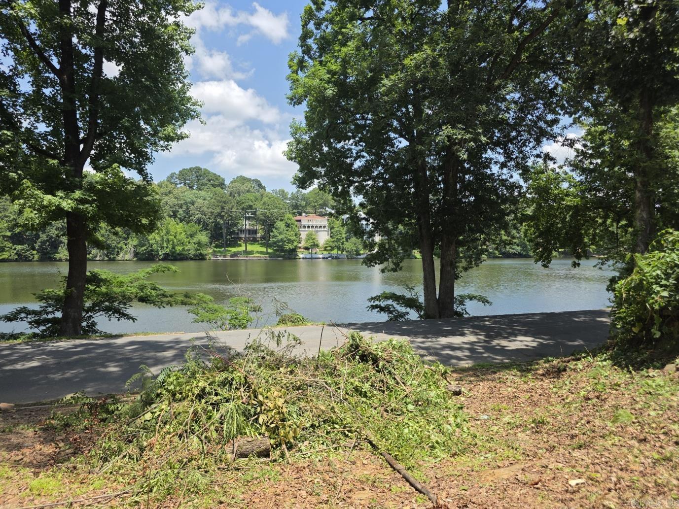 LOT FOR SALE overlooking NLR Lake #1 with most excavation already completed, this property offers a nearly pad-ready building site for your new home! You will enjoy wonderful lake views, just steps away from walking paths and a bridge for fishing.  Located in a quiet, family-friendly neighborhood just minutes away from shopping, dining, nearby playground and bike trail. However, 1920 Waterside Drive is also located within the Lakewood Recreational Improvement District, so even more amenities are available at a voluntary membership fee. https://lakewoodpoa.com/membership/
