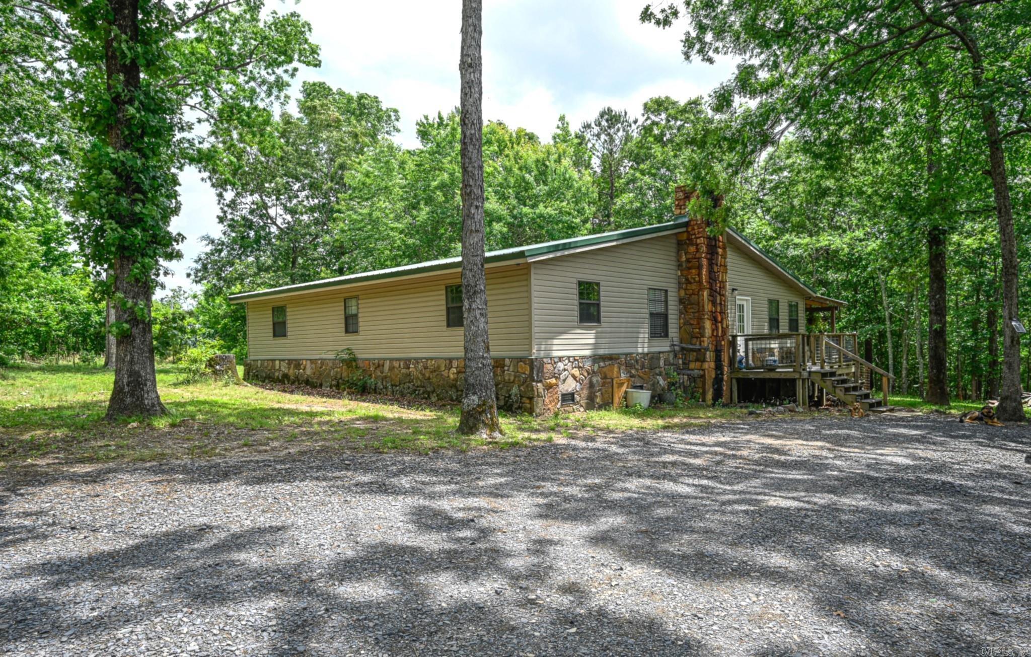 Surrounded by nature and tucked away in a serene setting, this property is ideal for those seeking quiet living with outdoor adventure just minutes away. The home and shop (30x40) both feature heat & air along with new metal roofs, providing comfort and durability for years to come. A backup wood heat system in the home adds extra warmth and peace of mind during the cooler months. Large laundry room with extra storage space. Large closets in bedrooms. Step out onto the back deck and enjoy year-round wildlife viewing while overlooking the peaceful surroundings. The pond is stocked with catfish and perch, toss some feed in and watch the excitement! Chicken coop, ready for your flock. 12x17 storage building offers additional space for equipment, hobbies, or outdoor gear. Enjoy the privacy you’ve been looking for without sacrificing the comfort of having great neighbors nearby. Approximately 3.5 wooded acres, let your mind run wild! 3 miles to National Forest and 3.5 miles to Irons Fork Reservoir, giving you quick access to hiking, fishing, ATV trails, and endless outdoor recreation. Agents see remarks.