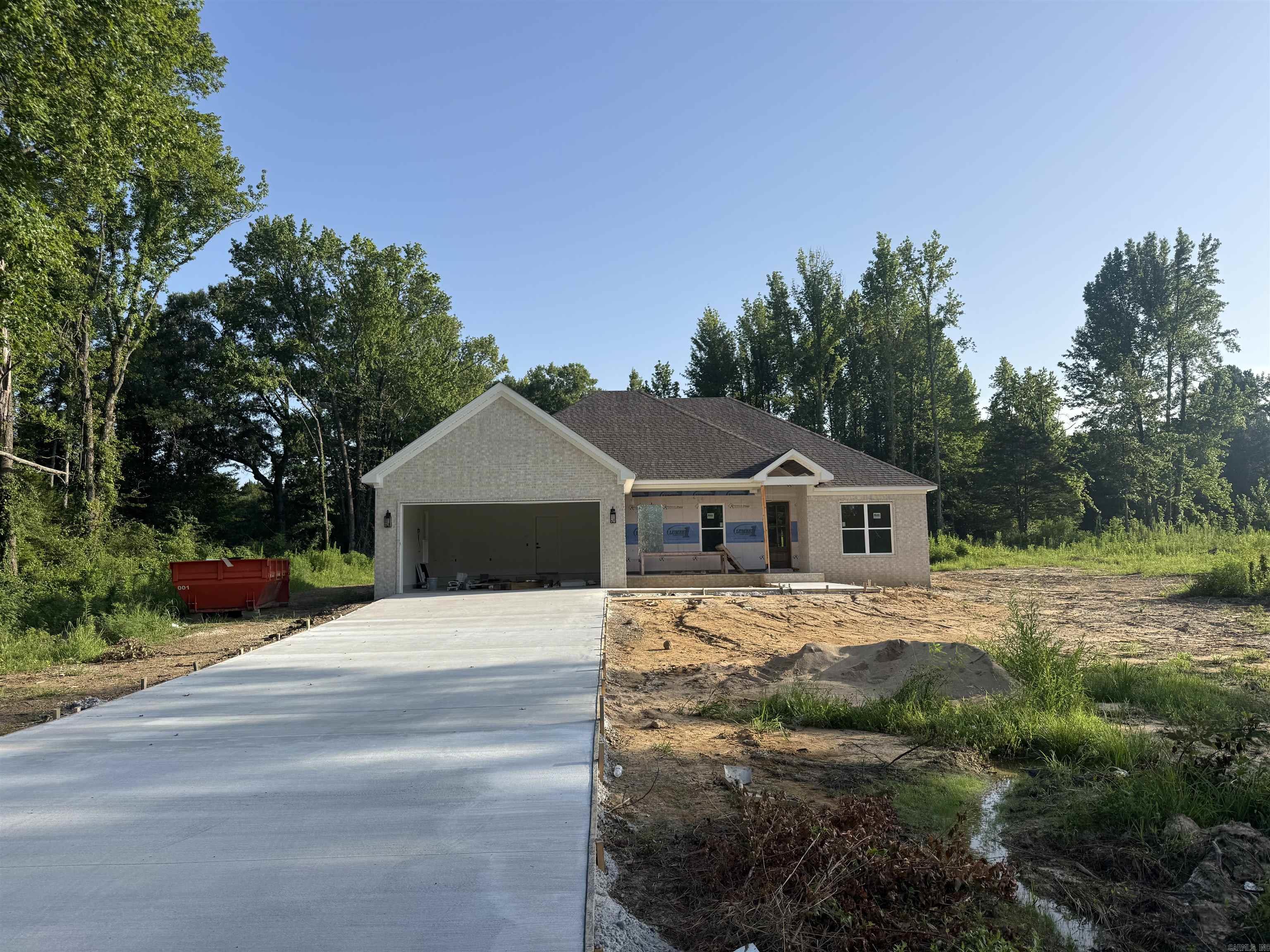 Beautiful new construction home on 1 acre in Greenbrier. Private backyard with a neighbor on only one side. Lots of extras in this home. Propane gas fireplace and cookstove. Big pantry. The kitchen is large with a huge island and lots of cabinets. Quartz countertops. Primary bedroom is separate from the guest bedrooms. Large office with built in cabinetry. Home will be finished in 3-4 weeks. Fence will be installed.