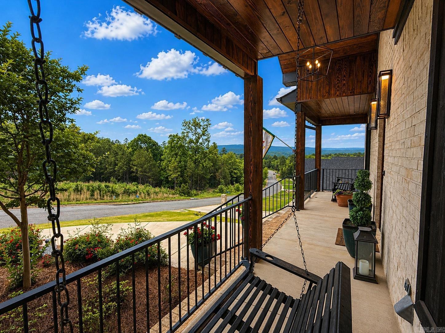 Just the right space, inside and outside in this beautiful 4-bedroom, 3-bath home!  With 3,300 square feet of thoughtfully designed space, this property backs up to peaceful woods, offering stunning views. The light brick exterior with warm wooden accents gives the home timeless curb appeal, while the spacious front porch provides an inviting spot to relax and enjoy the neighborhood atmosphere. Inside, you’ll find an open floor plan filled with natural light and a modern kitchen that’s both stylish and functional—complete with premium finishes, ample storage, and seamless flow into the living area. A bonus space upstairs offers flexibility for a game room, media room, or home office.  The primary suite is a true retreat, featuring a large walk-in shower and a soaker tub, large window and an oversized walk-in closet.   Step outside to the covered deck overlooking the wooded backdrop—a perfect setting for outdoor dining or quiet mornings with a cup of coffee. Additional features include a three-car garage and access to the many neighborhood amenities such as basketball and tennis courts, green spaces, and a GATED ENTRANCE.