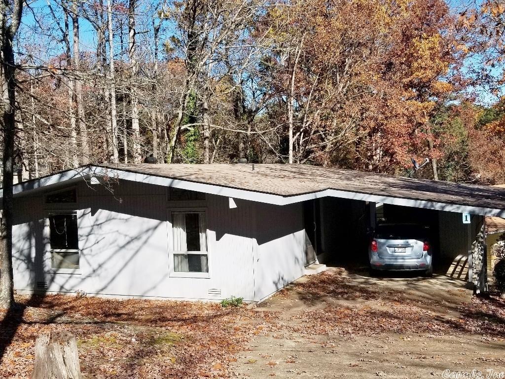Perfect starter home or rental  Approx. 1245 sq. ft., open vaulted plan, 2 Bedrooms, 1 and 1/2 baths. Large deck, carport, storage in carport.  Appliances fairly new. NEW ROOF! Great price at $129,000