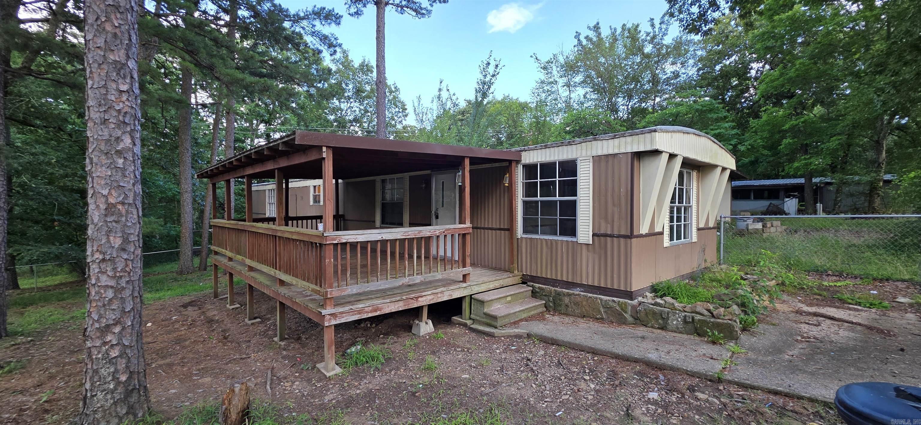 Well maintained mobile home on 2 lots in Fairfield Bay. 2/bed 2/bath, clean interior with regular upkeep. Large front porch with fenced in area.