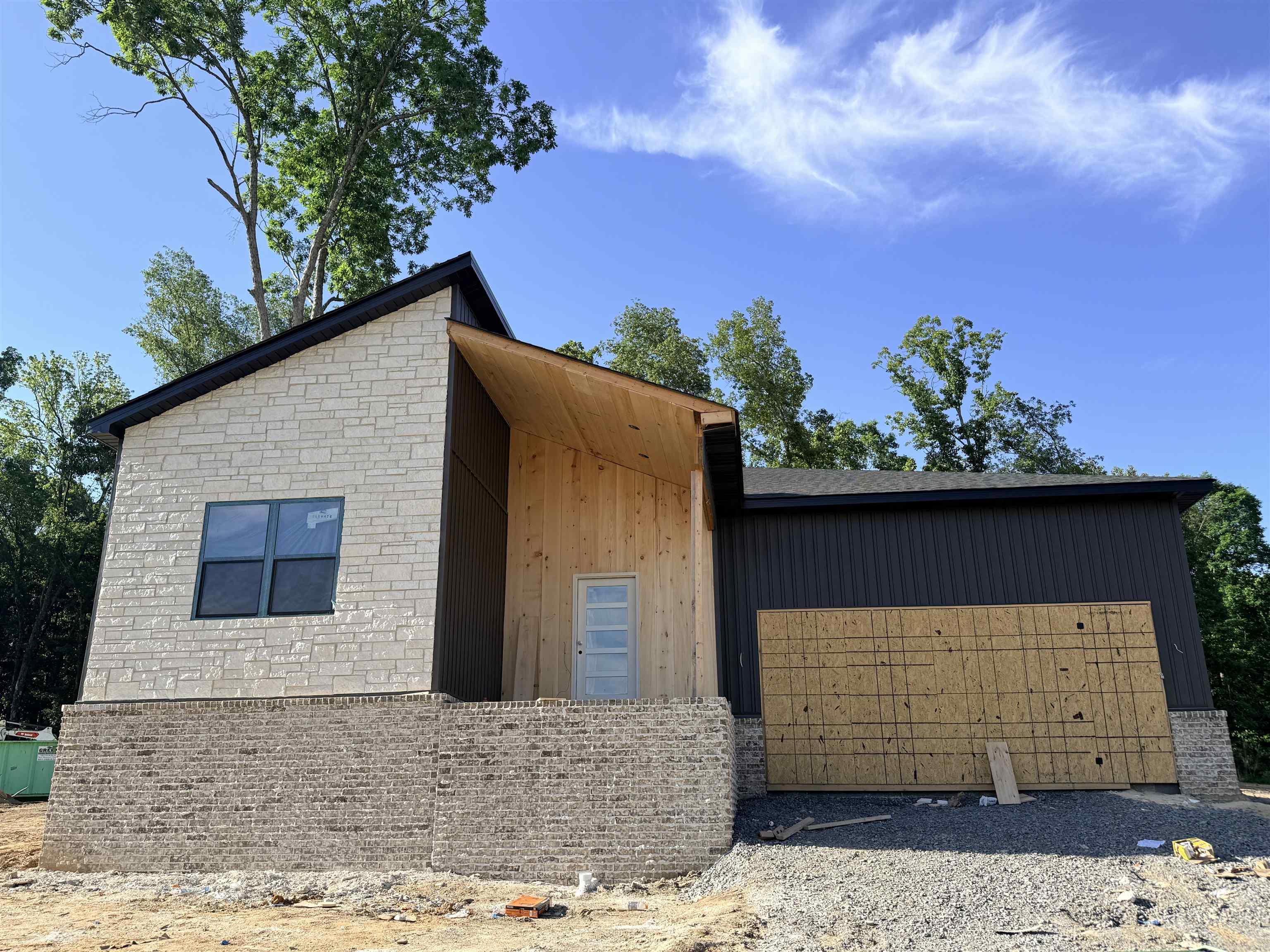 Discover this modern new construction home located in the desirable Cabot School District. This stunning property features an open layout perfect for today's lifestyle. The gourmet kitchen boasts ceiling height cabinets, a marble island, a wall oven, and a microwave, along with a large walk-through pantry that provides easy access from the garage. The spacious area allows for a dining table or a cozy sitting space, while accent walls and a built-in desk with lighting add a touch of elegance to the living area. The primary suite is designed with relaxation in mind, featuring a wet room shower with a soaker tub, a double vanity, and a large walk-in shower. Two additional bedrooms are thoughtfully separated from the primary suite, along with an accompanying bathroom. Step outside to the back patio adorned with beautiful wood accents, offering a serene view of the surrounding wooded oasis. This unique home is truly one-of-a-kind, perfect for those seeking luxury and comfort in a family-friendly neighborhood.