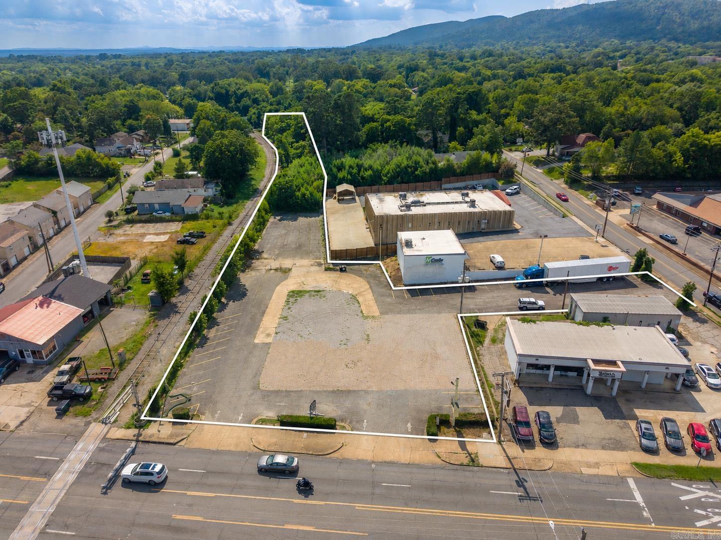 Prime Commercial Opportunity on Central Avenue! Position your business in one of Hot Springs' most visible and high-traffic corridors. This commercially zoned lot offers exceptional exposure with over 23,000 vehicles passing daily along Central Avenue, providing outstanding visibility for retail, restaurant, office, medical, or service-related development. Ideally situated between Oaklawn Racing Casino Resort and Historic Downtown Hot Springs, the property benefits from steady traffic generated by both locals and visitors year-round. Surrounded by established businesses, restaurants, hotels, and attractions, this is a rare opportunity to secure a premier commercial location in the heart of Hot Springs. The offering also includes an adjoining lot, providing additional space and flexibility for expanded development or future growth. Whether you're expanding an existing business or developing a new venture, this high-profile site offers the location, accessibility, and visibility to help your business succeed.