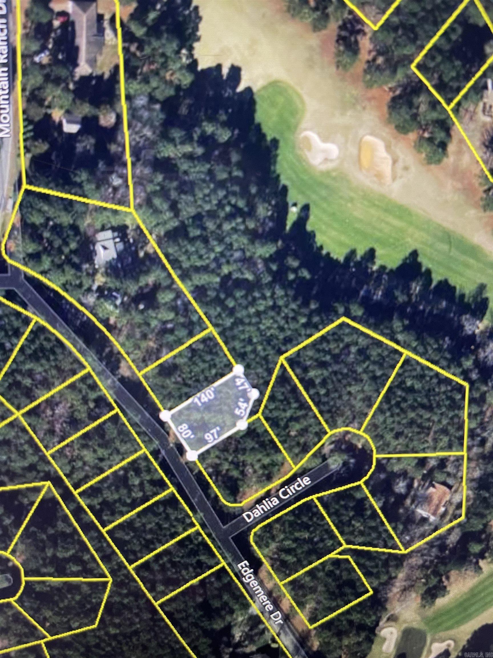 Come build your dream home today on the golf course frontage lot. Enjoy living in Fairfield Bay, where every day feels like a vacation! Nestled amidst the picturesque landscapes of the Mountain Ranch Golf Course, this area offers you the perfect blend of relaxation & adventure.  With this prime location, you can indulge in your passion for golf anytime you desire. Tee off during the day & as the sun sets, bask in the breathtaking views of the shimmering lake nearby. This is the epitome of tranquil living at its finest. But that's not all! Fairfield Bay boasts a plethora of amenities to enrich your life. Within minutes of your new abode, you'll find a full-service marina, beckoning you to embark on aquatic adventures whenever the mood strikes. Dive into the refreshing waters of one of the three swimming pools, or challenge your friends to a game of tennis or pickleball. Feel the thrill of exploration as you traverse the hiking & biking trails, or opt for a leisurely round of miniature golf or disc golf. With over 80 miles of UTV trails at your disposal, the possibilities for outdoor recreation are endless.