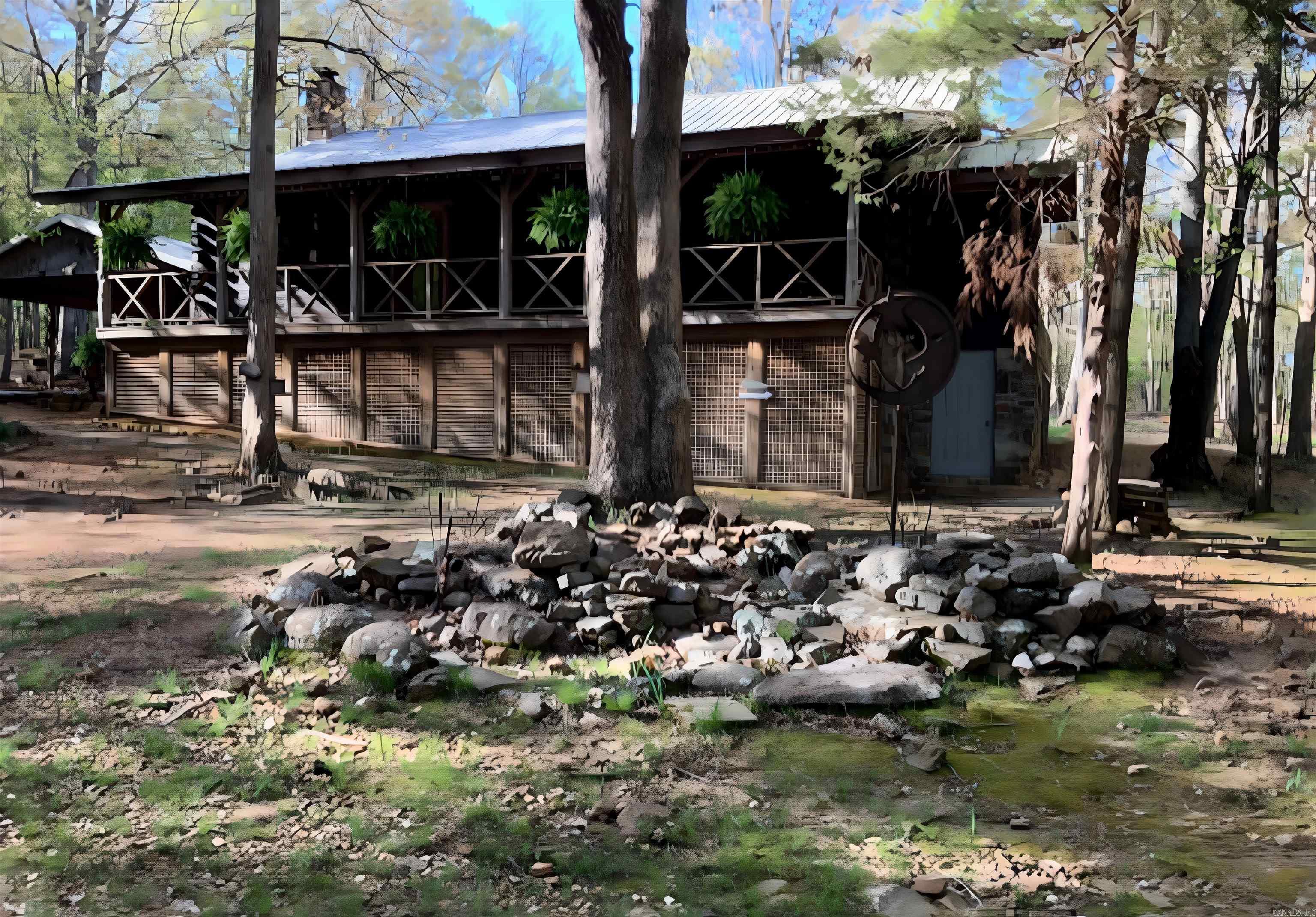 Escape to the Ozarks with this stunning 2,600 sq. ft. log cabin on 46.96 acres M/L of beautiful, wooded land. Surrounded by nature, the home features a full wraparound porch and a walkout basement with a private MIL suite. Upstairs offers 2 bedrooms and 2 baths, while the basement suite includes 1 bedroom, 1 bath, and its own living space—perfect for guests or extended family.  This property is full of extras, including a spacious art studio, large chicken coop, fenced garden, and multiple outbuildings. A charming 100-year-old home also sits on the land, offering restoration potential. For additional income or guest accommodations, a 600 sq. ft. guest house is located away from the main residence and currently has a renter in place.  The land itself is a rare find, complete with a seasonal creek, pond, and plenty of space to roam, garden, or simply enjoy the peaceful surroundings. Whether you’re looking for a private homestead, an income-generating property, or a retreat in the woods, this one has endless possibilities.