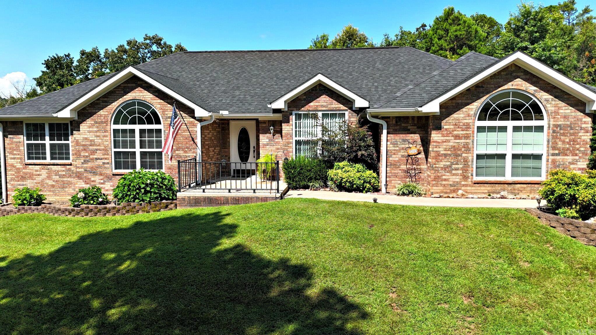 Amazing 3 bedroom, 2 bath brick home in Timber Ridge East, just minutes from Mena’s amenities and a pretty setting and extra landscaping. Inside you’ll find a comfortable layout with lots of storage, plus thoughtful updates made since the seller’s purchase in 2020. Engineered wood & Tile floors. The kitchen and laundry areas feature extra shelving and a generous pantry, and all appliances convey (except the stand-up freezer) for easy move-in. A standout feature is the screened-in back porch, adding about 240 square feet of additional living space with pull-down shades and a ceiling fan, ideal for relaxing or entertaining. Outside, extra landscaping enhances curb appeal, and the oversized, 516 Sq.Ft. garage, and storage shed (both with roofs replaced roughly three years ago) provide plenty of room for vehicles and tools and lots more. There is also a sizeable safe room (approx. 43x46) offering both security and more storage options. If you’re looking for a well-maintained brick home in a desirable neighborhood close to town, this Timber Ridge East property is a must-see.