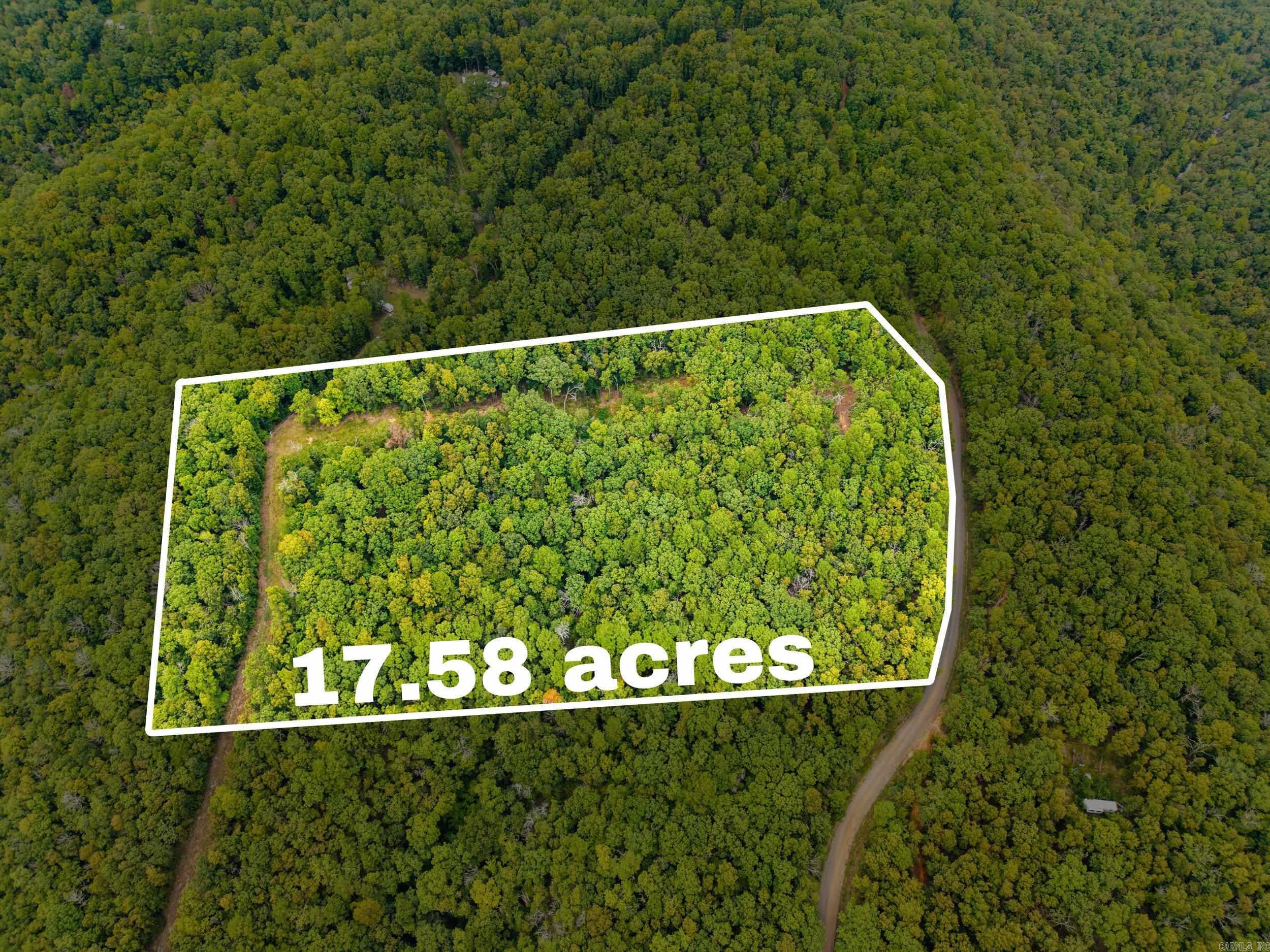 This piece of the Ozark Mountains is one you must see!  Greers Ferry Lake and the Buffalo River are just a short drive away.  Serene wooded mountain view property with power, 10 X 12 and 18' tall storage shed building.  City water is available across the road and very close by.  No restrictions!  Mobiles allowed!  Existing survey!  Perk Test was completed!