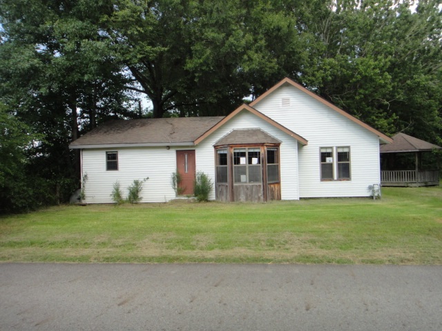 Country setting, large lot. Enjoy evenings under the gazebo. Seller does not pay customary closing cost: including Title Policy, escrow fees, survey, or transfer fees. Proof of funds required on cash transactions, Lender Pre-Approval letter for financed offers (dated within last 30 days). Seller is Secretary of Veterans Affairs. See Agent Remarks for submitting an offer.