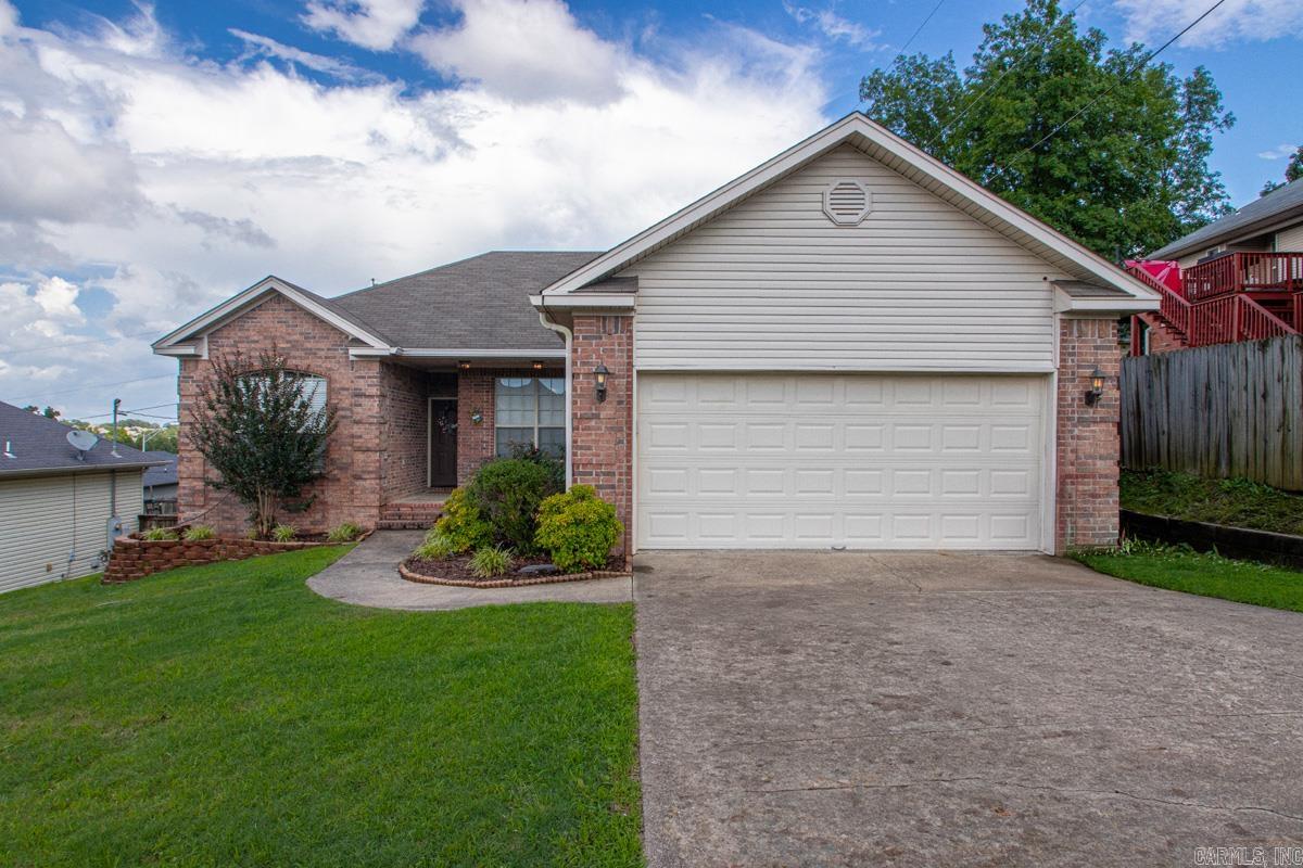 This move in ready cutie could be your new home! With a spacious split floor plan and two car garage, it offers a highly functional layout for the whole family. The kitchen has great cabinet space and a nice dining area adjacent. A dedicated laundry is right off of the garage. Outdoors you can enjoy your private deck and raised garden beds already established. Updates include paint and new LVP flooring in the main and primary suite. The living area is open and airy with great natural light. Welcome Home! New water heater and hvac 2025.