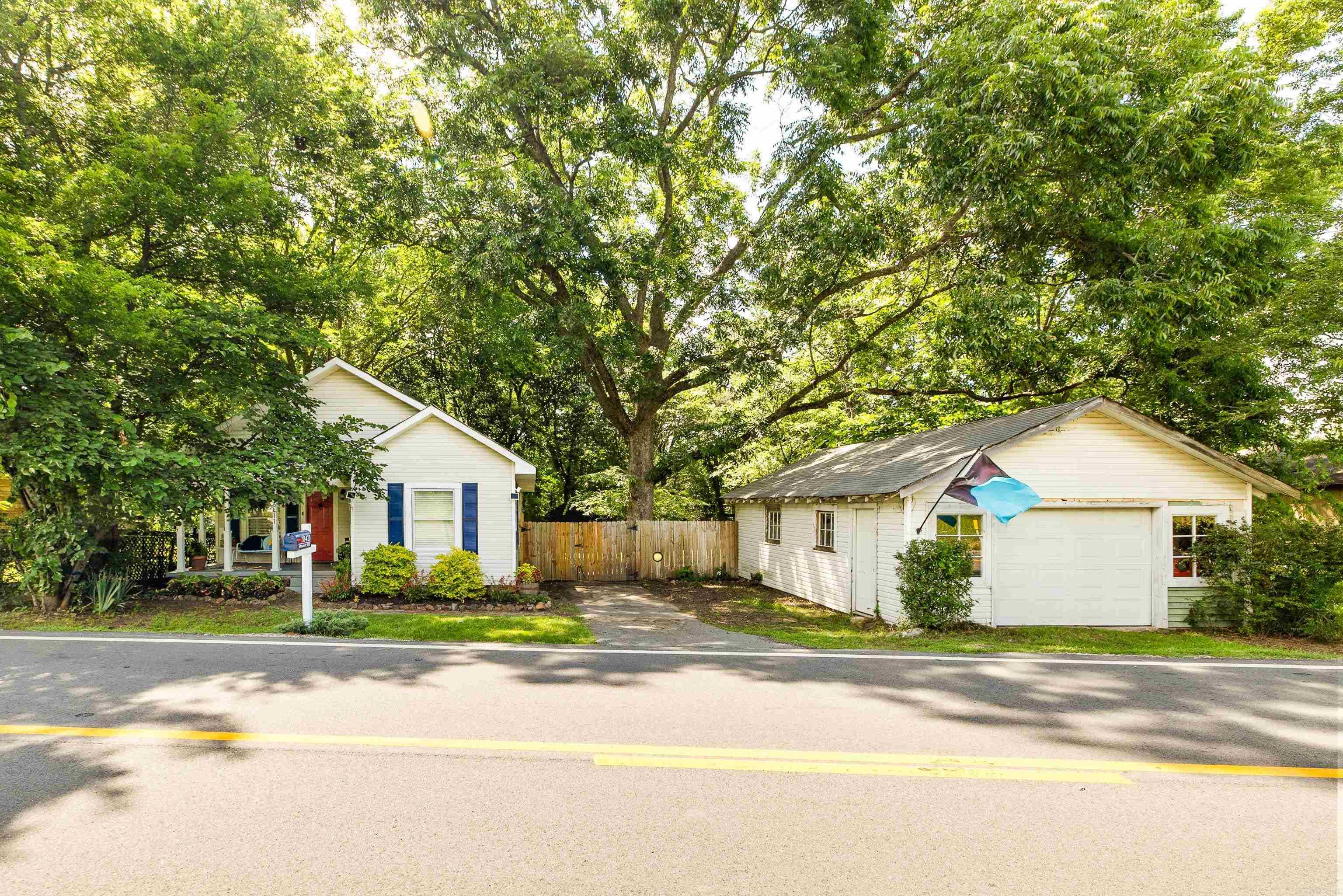 Updated home in great location. Joe T Robinson Schools, less than 5 minutes from Bobrook Farms and less than 15 minutes to Walmart. This beautifully maintained 1915 cottage in Roland offers timeless character with modern comfort. Original hardwood floors, tall ceilings, oversized trim, and glass French doors create warmth and personality throughout the home. The spacious dining room and inviting living spaces feel cozy yet functional, while the updated kitchen features stainless appliances, gas range, black tile countertops, and reclaimed wood accents from historic Shorty Smalls restaurant. Recent improvements include refinished hardwood floors, interior paint, new roof (2022), crawlspace renovation and structural repairs (2024), full drainage system (2024), and new septic system (2025). Sellers are refurbishing parts of the garage. Enjoy a fenced backyard shaded by mature trees with firepit area, detached shop/storage building, and welcoming front porch perfect for relaxing evenings. Known by longtime locals as the “old Van Cleve house,” this property is full of history, charm, and one-of-a-kind character you simply can’t recreate. Some photos have AI virtual staging. See remarks