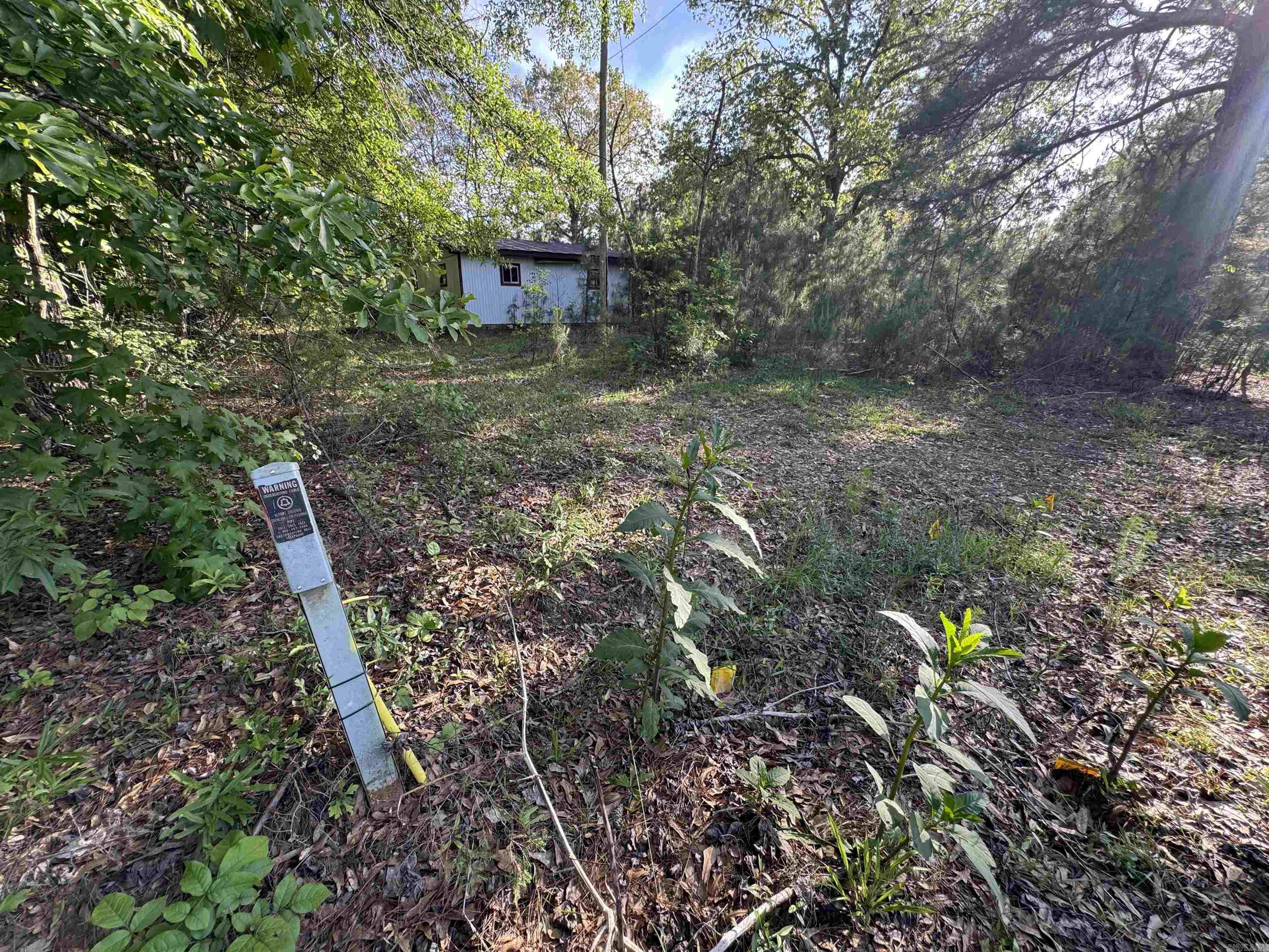 Rural acre ready for a new build, mobile home, or modular!  A 24x24' shop with slab foundation gives you a head start on storage.  Mobile home was located on the property at one time, but condition or exact location of utilities is unknown.