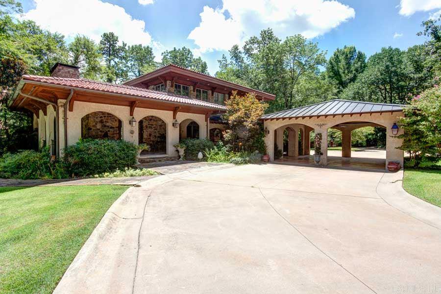 TUSCAN RETREAT IN THE HEART OF THE HEIGHTS ON 14 ACRES!  GATED COMPOUND - TOTALLY REMODELED MAIN HOUSE HAS 4315 SQUARE FEET WITH NATURAL STONE FLOORING THROUGHOUT.  WONDERFUL KITCHEN WITH EVERY AMENITY INCLUDING A NEW SONIC ICEMAKER!  MASTER SUITE ON MAIN LEVEL WITH SPA BATHROOM.  NEWER GUEST HOUSE (1,074 S.F.) OVER 3 CAR GARAGE, PROFESSIONAL WORKSHOP (2,399 S.F.) WITH FULL BATH. LITTLE ROCK NATIVES WILL REMEMBER THIS AS THE OLD ROCKCRUSHER LOCATION. VERY SPECIAL PROPERTY!