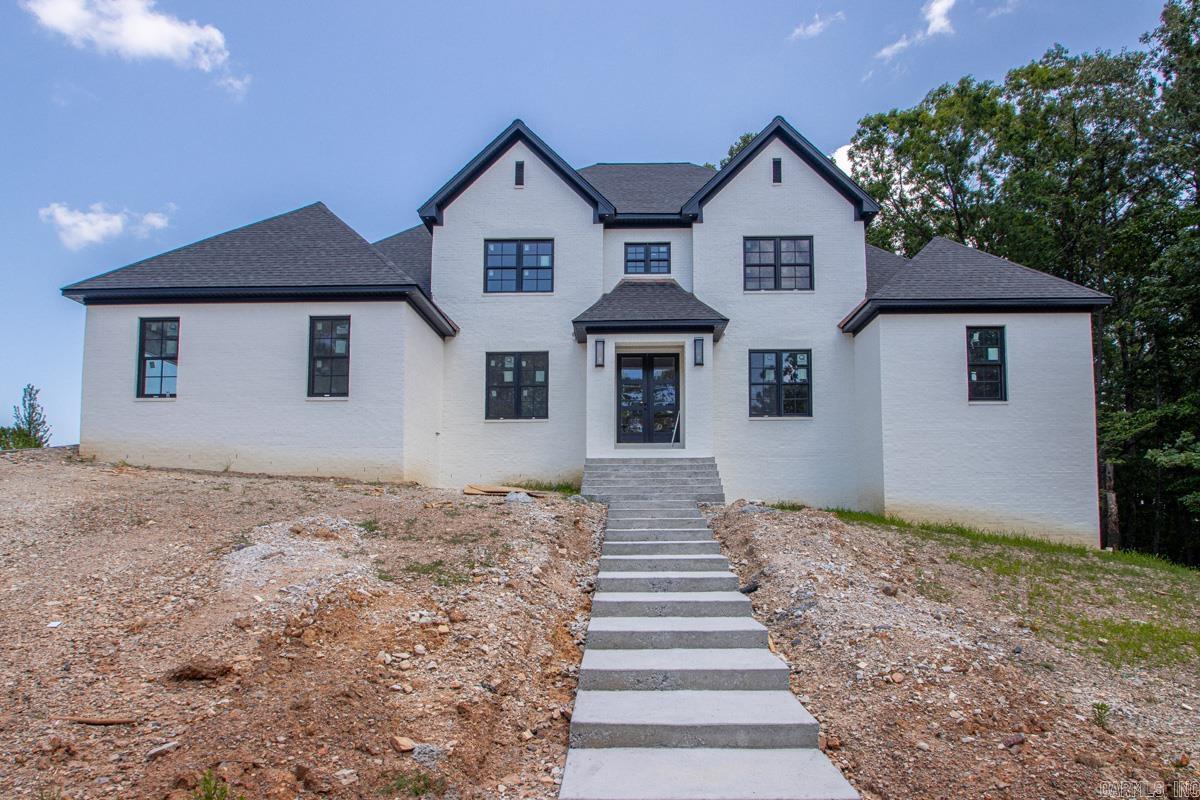 Luxury & timeless craftsmanship in this new construction home located in the gated community of Founders Estates. This home sits on a half acre lot with 5 bedrooms, 5 full baths, & 4212 sqft. Every detail has been thought out to create a function design. There are hardwood floors, designer finishes, & an abundance of natural light. The kitchen features custom cabinetry, stunning quartz countertops, a spacious walk-in pantry, & professional-grade appliances. The luxurious primary suite offers a private retreat w/an exceptional primary bath & closet. Upstairs are 3 spacious guest bedrooms each have their own private en-suite bathroom. A generous loft offers flexible space for a media room, game room, home office, or additional living area. Enjoy year-round outdoor living on the covered back patio & outdoor fireplace. The oversized four-car garage, tankless water heater, and irrigation system add everyday convenience to this home's impressive list of amenities. This home is located just moments from The Promenade at Chenal and entertainment along Chenal Parkway.