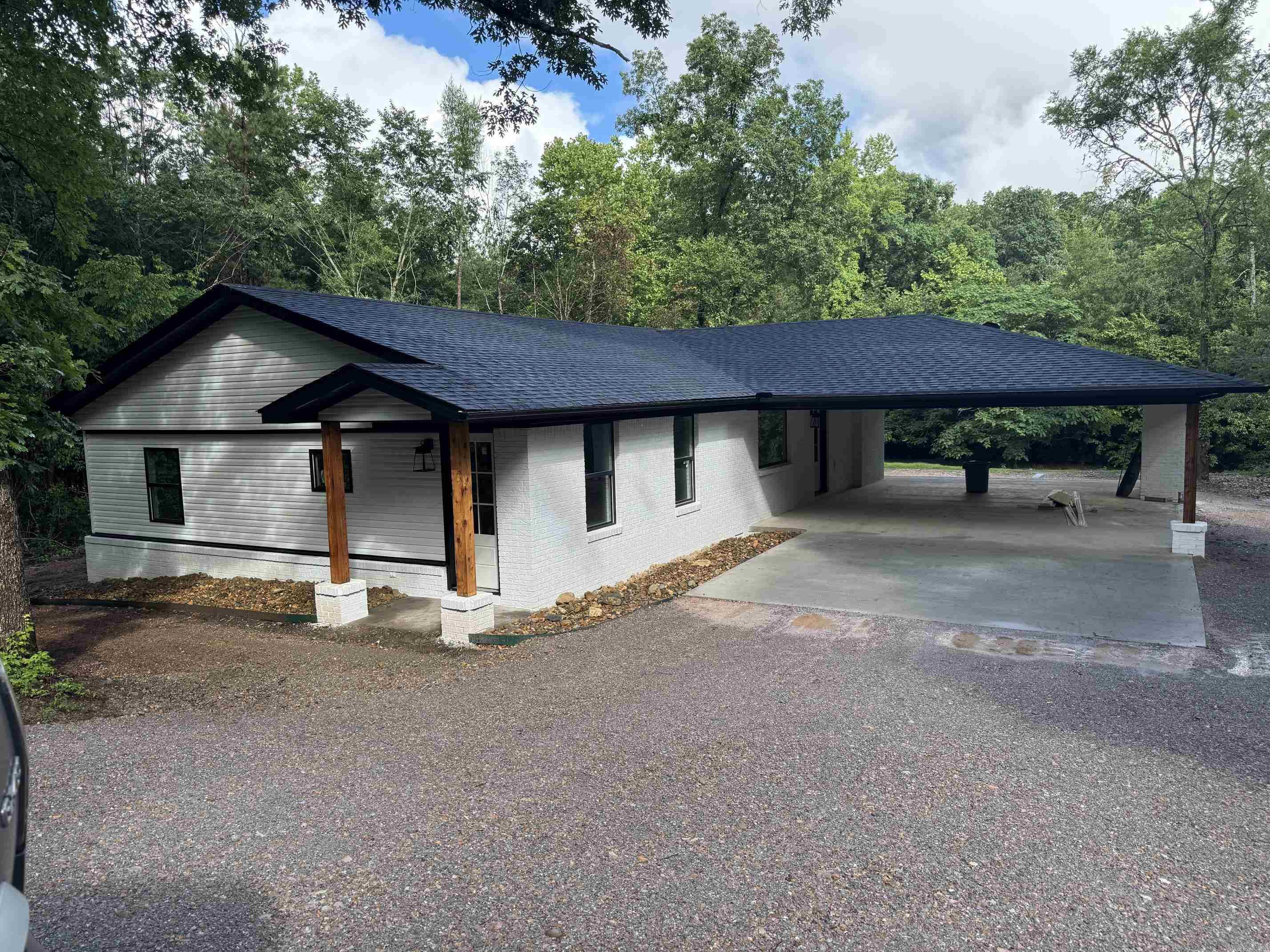 Completely remodeled 3 bedroom, 2 bath home on beautiful Lake Hamilton! This home has been taken down to the bare bones and completely rebuilt with quality updates throughout. Everything has been redone including plumbing, electrical, insulation, HVAC, cabinets, subfloors, and windows — giving you the feel of a brand-new home with the charm of lake living.  Enjoy the spacious outdoor entertaining area featuring a cozy fireplace overlooking the lake, perfect for relaxing evenings or hosting family and friends. Whether you’re looking for a full-time residence, weekend getaway, or investment property, this updated lake home is move-in ready and designed for enjoying life on the water.**Better pictures coming soon**