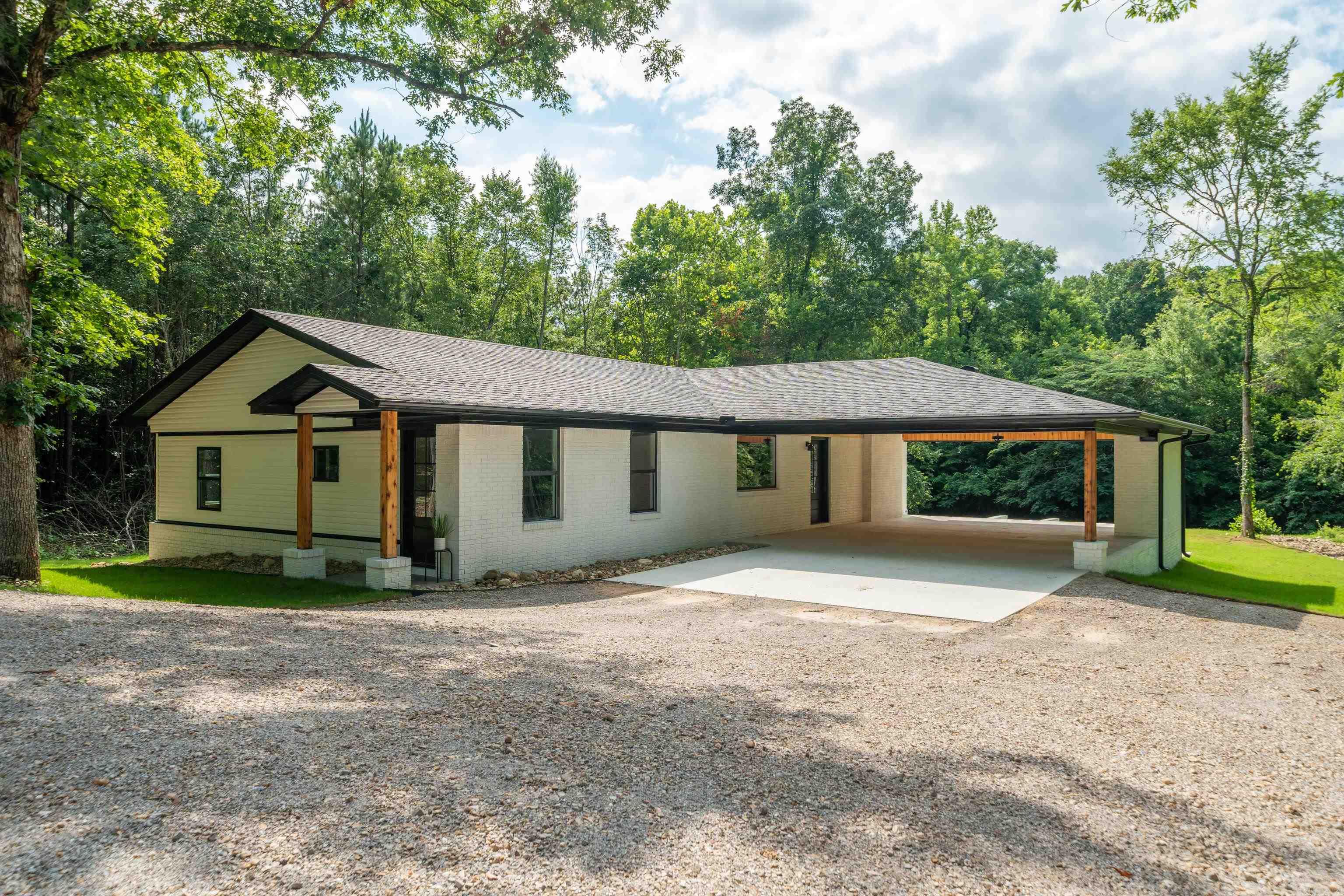 Completely remodeled 3 bedroom, 2 bath home on beautiful Lake Hamilton! This home has been taken down to the bare bones and completely rebuilt with quality updates throughout. Everything has been redone including plumbing, electrical, insulation, HVAC, cabinets, subfloors, and windows — giving you the feel of a brand-new home with the charm of lake living.  Enjoy the spacious outdoor entertaining area featuring a cozy fireplace overlooking the lake, perfect for relaxing evenings or hosting family and friends. Whether you’re looking for a full-time residence, weekend getaway, or investment property, this updated lake home is move-in ready and designed for enjoying life on the water.**Better pictures coming soon**