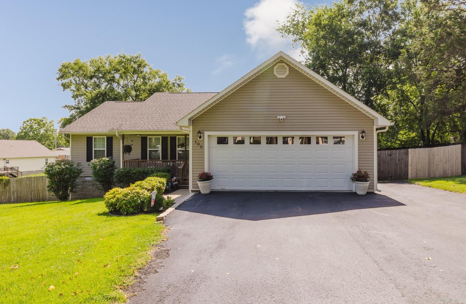 Immaculate 3 bedroom, 2 bathroom home in the Lake Hamilton School District! This move-in ready home features a spacious living room, a kitchen with plenty of cabinetry, and an eat-in dining area. Beautiful tile and laminate flooring throughout—no carpet! Enjoy the large fenced backyard with a covered deck, perfect for relaxing or entertaining. Pretty landscaping, extra parking space, and a great layout make this home a must-see!  Additional storage located under the home.  Smart features include a smart thermostat, lighting in kitchen, exterior flood lights, and front door camera and lock.