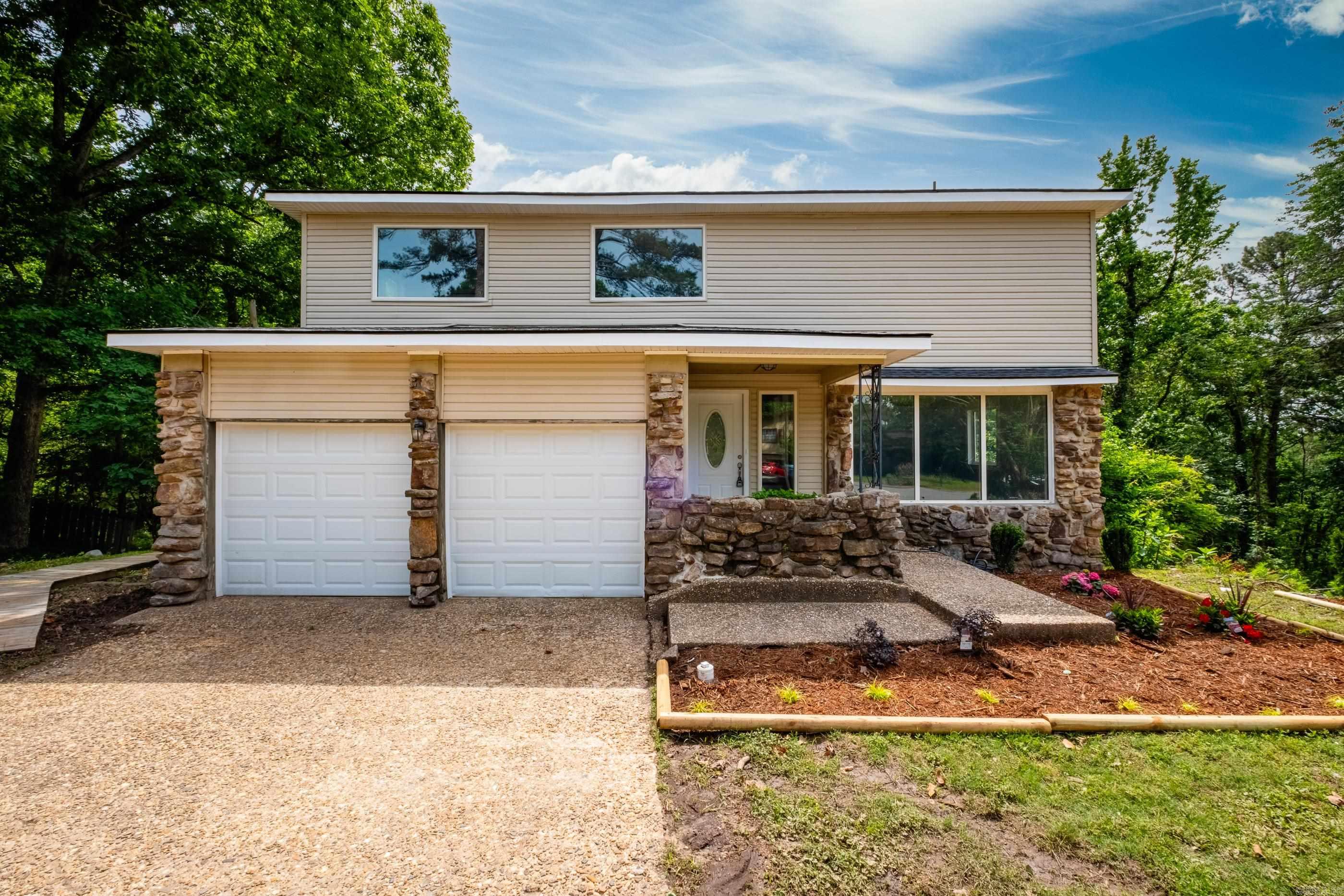 This home is essentially brand-new! The roof, windows, doors, flooring, cabinets, countertop, vanities, toilets, showers, garage doors, HVAC systems (2), water heater, deck, and electrical service are all brand new!   The appliances are new and will convey to the new buyer!   This home features two principal suites on the top floor, each with its own private bathroom and private balcony. All three balcony doors are fully slide-to-open, really opening up the space and airflow.  In total, there are 4 bedrooms, 3 full bathrooms, and a half bathroom for guests on the main floor. The 2,364 sqft goes a long way in this home!  The deck is a 3-story masterpiece with access to the very large basement that features new subflooring. Perfect for a shop, a game room, extra storage, or any other accommodation!   The brand-new tall windows throughout the home fill the space with natural light.  Schedule your tour today! You don't want to miss out on this one!   See agent remarks.