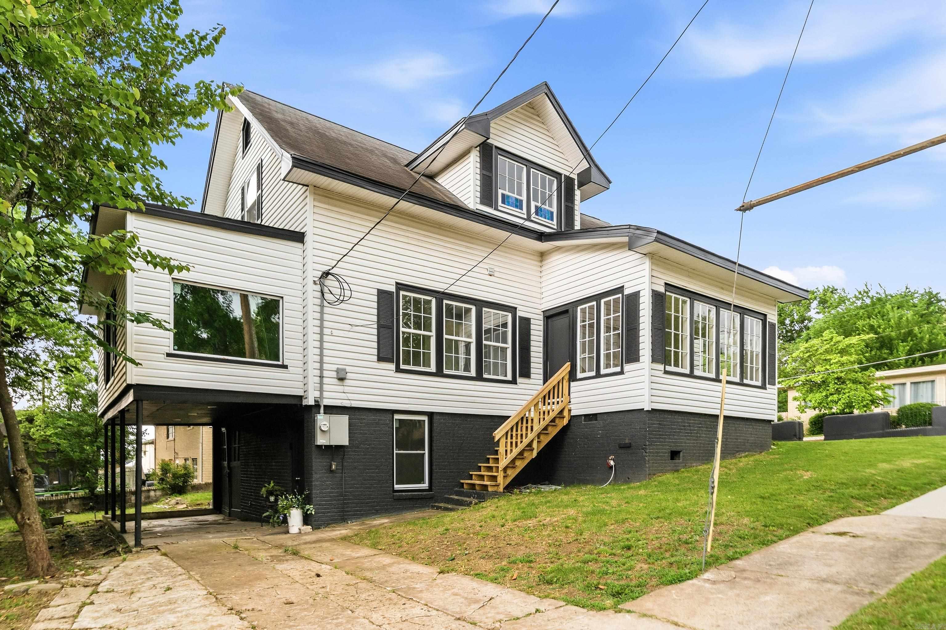 Beautifully restored 1938 historic cottage blending timeless character with  elevated aesthetics perfect for entertaining, working from home, or simply enjoying everyday living & long walks with your fur babies. This thoughtfully renovated home showcases original refinished soft pine hardwood floors, preserved stained glass accents, original doors and restored vintage glass doorknobs that honor the home’s architectural charm. A Light-filled sunroom with walls of windows creates the perfect sitting area, office, or flex space. Major improvements include all new plumbing, updated electrical, new HVAC units, new water heater, fresh interior and exterior paint, and many new windows throughout. The updated kitchen features quartz countertops, new appliances, and clean modern finishes while maintaining the home’s historic integrity. Renovated baths, beautiful natural light & preserved original details make this one-of-a-kind property truly move-in ready, virtually maintenance free. Conveniently located with easy access to dining, shopping, and business districts, this distinctive property offers the rare opportunity to own a piece of history without sacrificing contemporary convenience.
