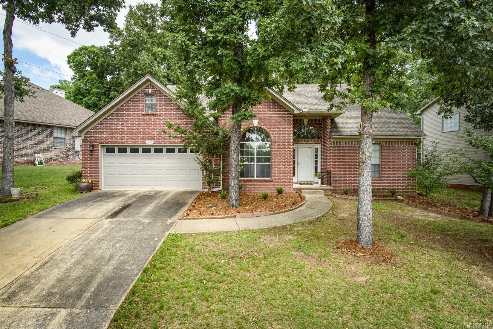 Welcome to 1907 Cherrybend! Ideally located in West Little Rock with convenient access to shopping, dining, parks, and everyday amenities, this home offers a fantastic opportunity to make it your own. The inviting living room features a gas log fireplace and flows into the eat-in kitchen, creating a comfortable space for daily living and entertaining. A formal dining room and laundry room are conveniently located on the main level. The spacious main-level primary suite includes access to the back patio, an en-suite bath, and walk-in closet. Upstairs, you’ll find two additional bedrooms and a full bath. Outside, enjoy the fenced backyard, patio area, and 2-car garage. A Generac generator adds extra peace of mind. With a great location, functional floor plan, and plenty of potential to add your personal style and updates, this home is ready for its next chapter. Agents, please see remarks.