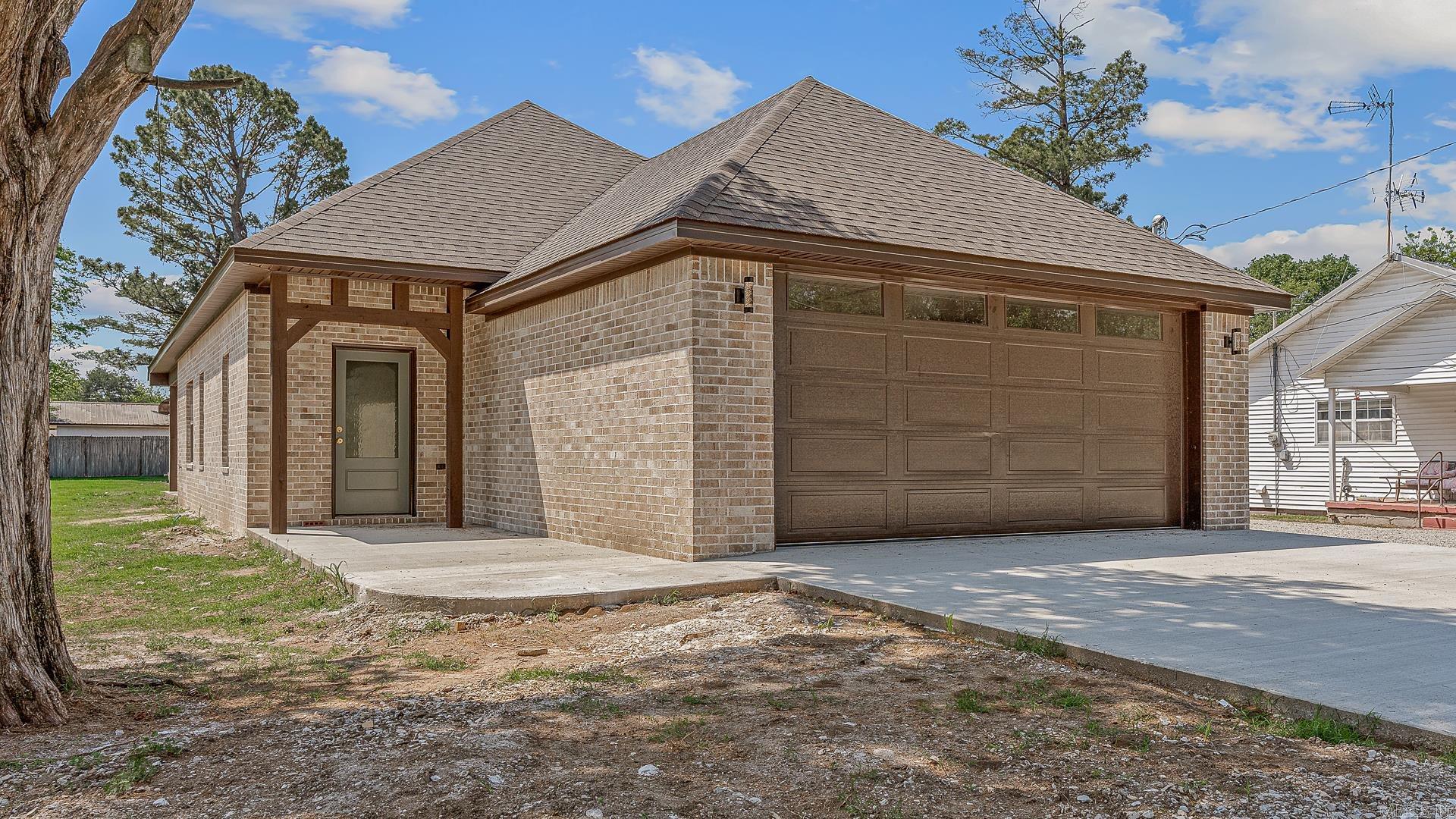 Just 30 minutes from Nucor, Big River Steel, and Jonesboro, this newly completed home is full of charm! A warm front porch with rich wood accents welcomes you inside to an open, airy layout with tall ceilings, sage green cabinetry and trim, granite countertops, custom tile, warm LVP flooring, and beautiful gold finishes. The primary suite features a timeless tiled shower, while the covered back patio offers the perfect place to relax or entertain. Stylish, comfortable, and thoughtfully designed — this one truly stands out!