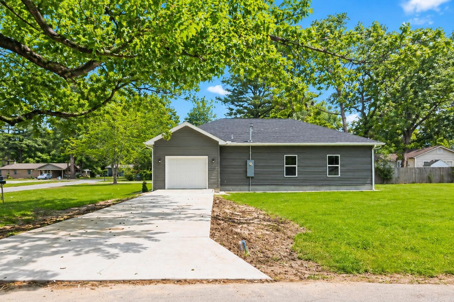 Come and tour this 3 bd. 2 ba. Brand new, new construction home with an open floorplan. It has soaring ceilings, granite countertops, luxury vinyl flooring, custom cabinets, and more! You'll just love the gorgeous heat producing LED fireplace. The tall windows gives a more bright modern look with beautiful lighting. It features a separate laundry room, spacious bedrooms, and custom closets. You'll love the unique fixtures throughout the home. It also features a master bedroom suite and bathroom with a luxurious walk-in shower with seating. It also has a custom built spacious walk-in closet. This beautiful home sits on the corner with a oversized lot for plenty of space for entertaining family and summer bbq's. The neighborhood is peaceful and quiet and it's only a couple of minutes from Heritage Park and has easy access to the highway. This home is move-in ready. Call or text listing agent today to take a tour. Don't miss this opportunity! It won't last long!  **Agents check remarks.  Some photos have been enhanced with AI to provide better lighting.