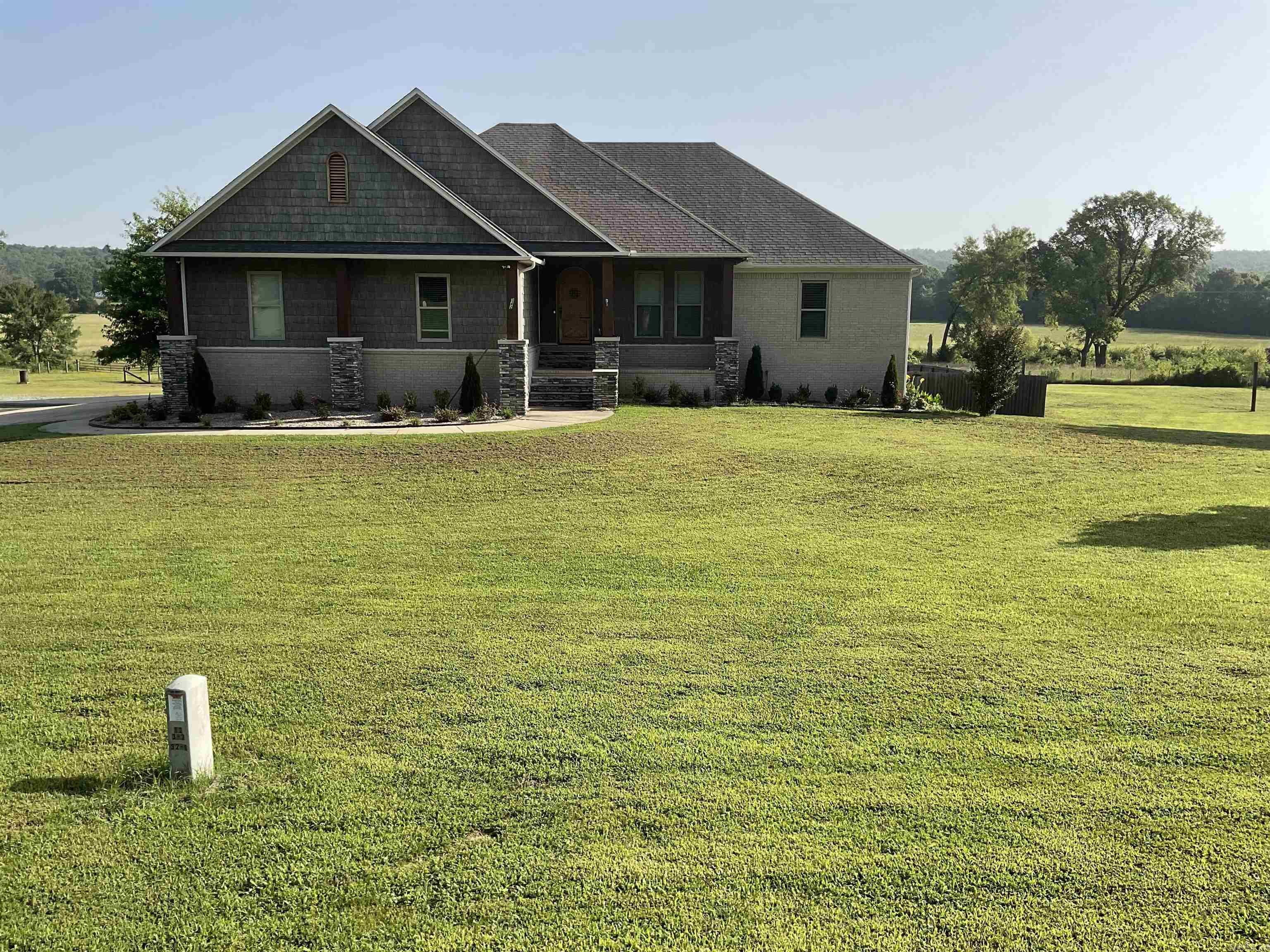 Experience luxury country living on 17  fully fenced acres with a scenic pond and barn, perfect for livestock or hobby farming. An additional 9.84 acres is available for those seeking even more space and privacy.  This beautiful 3-bedroom home features 4 full baths plus a half bath by the pool area. The main level offers a spacious kitchen with abundant storage, ideal for entertaining. Downstairs includes a full second kitchen, a flexible room for a bedroom, and a full bath—perfect for guests or multi-generational living.  Enjoy your private outdoor retreat with an oversized pool and multiple covered entertaining areas, all surrounded by peaceful acreage.  Recent updates include: new pool liner (2023), ice maker (2023), upstairs appliances (2023), downstairs appliances (2024), elevator battery (2024), added ceiling fans, new shop window, and barn repaint (2023).  24-hour notice required for showings.