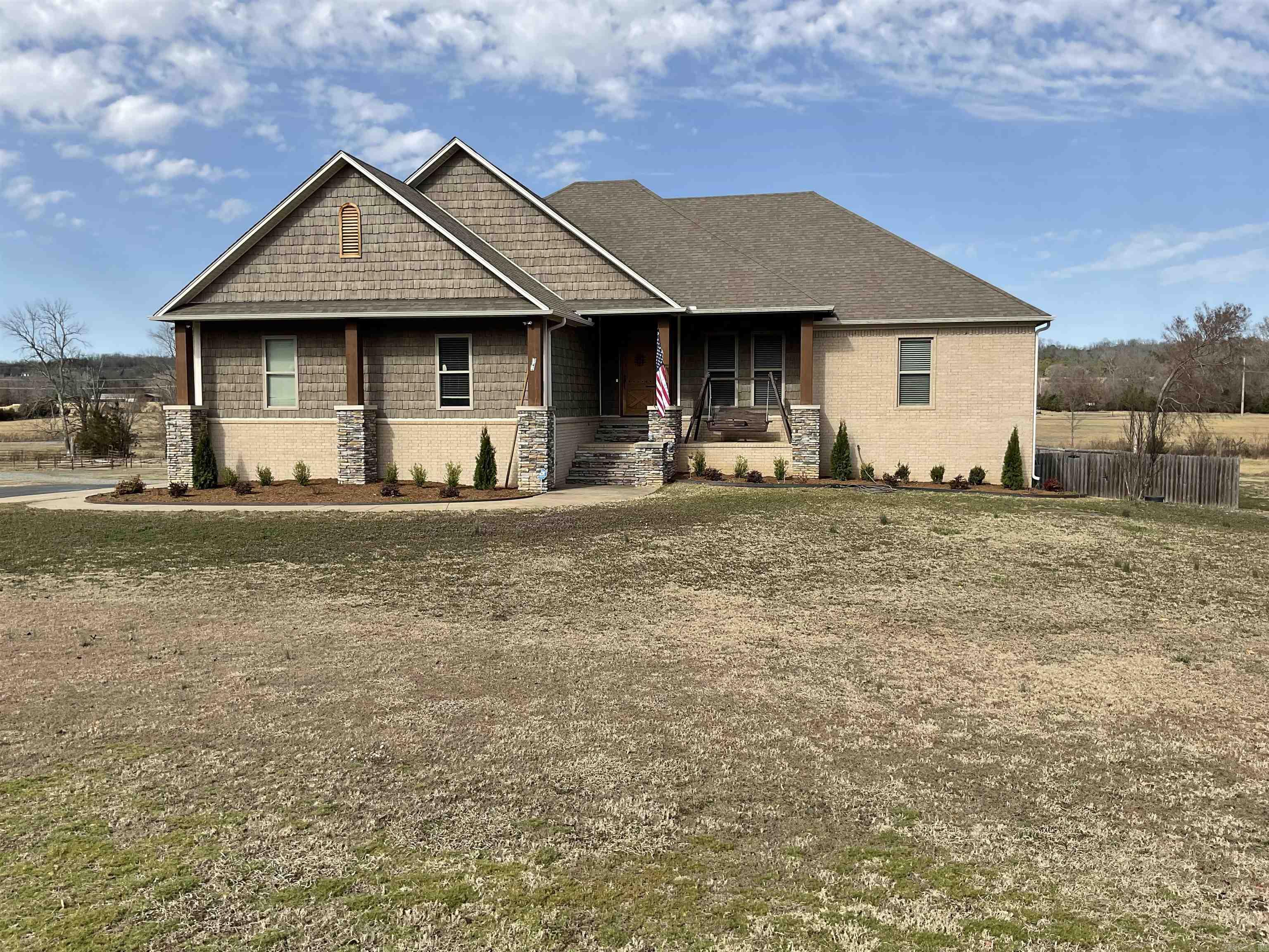 Experience luxury country living on 17  fully fenced acres with a scenic pond and barn, perfect for livestock or hobby farming. An additional 9.84 acres is available for those seeking even more space and privacy.  This beautiful 3-bedroom home features 4 full baths plus a half bath by the pool area. The main level offers a spacious kitchen with abundant storage, ideal for entertaining. Downstairs includes a full second kitchen, a flexible room for a bedroom, and a full bath—perfect for guests or multi-generational living.  Enjoy your private outdoor retreat with an oversized pool and multiple covered entertaining areas, all surrounded by peaceful acreage.  Recent updates include: new pool liner (2023), ice maker (2023), upstairs appliances (2023), downstairs appliances (2024), elevator battery (2024), added ceiling fans, new shop window, and barn repaint (2023).  24-hour notice required for showings.
