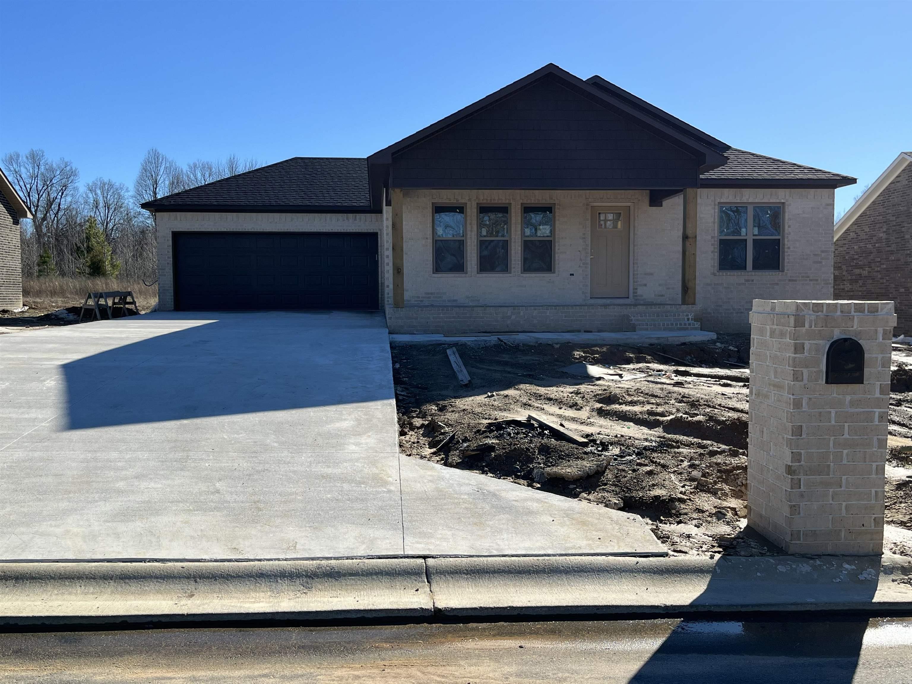 Check out this modern farmhouse style- new construction home in Ridge Park subdivision! This home has a one of a kind curb appeal with the garage tucked back and a large front porch. As you walk in from the garage, the kitchen overlooks the living area that is the perfect size for having family and friends over! The kitchen offers great cabinet space, will have granite countertops, stainless appliances, and a breakfast bar. The split floor plan has 2 bedrooms and 1 bath on one side of the house with the master suite having a more private feel. The master has a walk in closet with a large vanity in the bathroom. This home also has a covered back porch and a nice backyard. Call today before this one is gone!