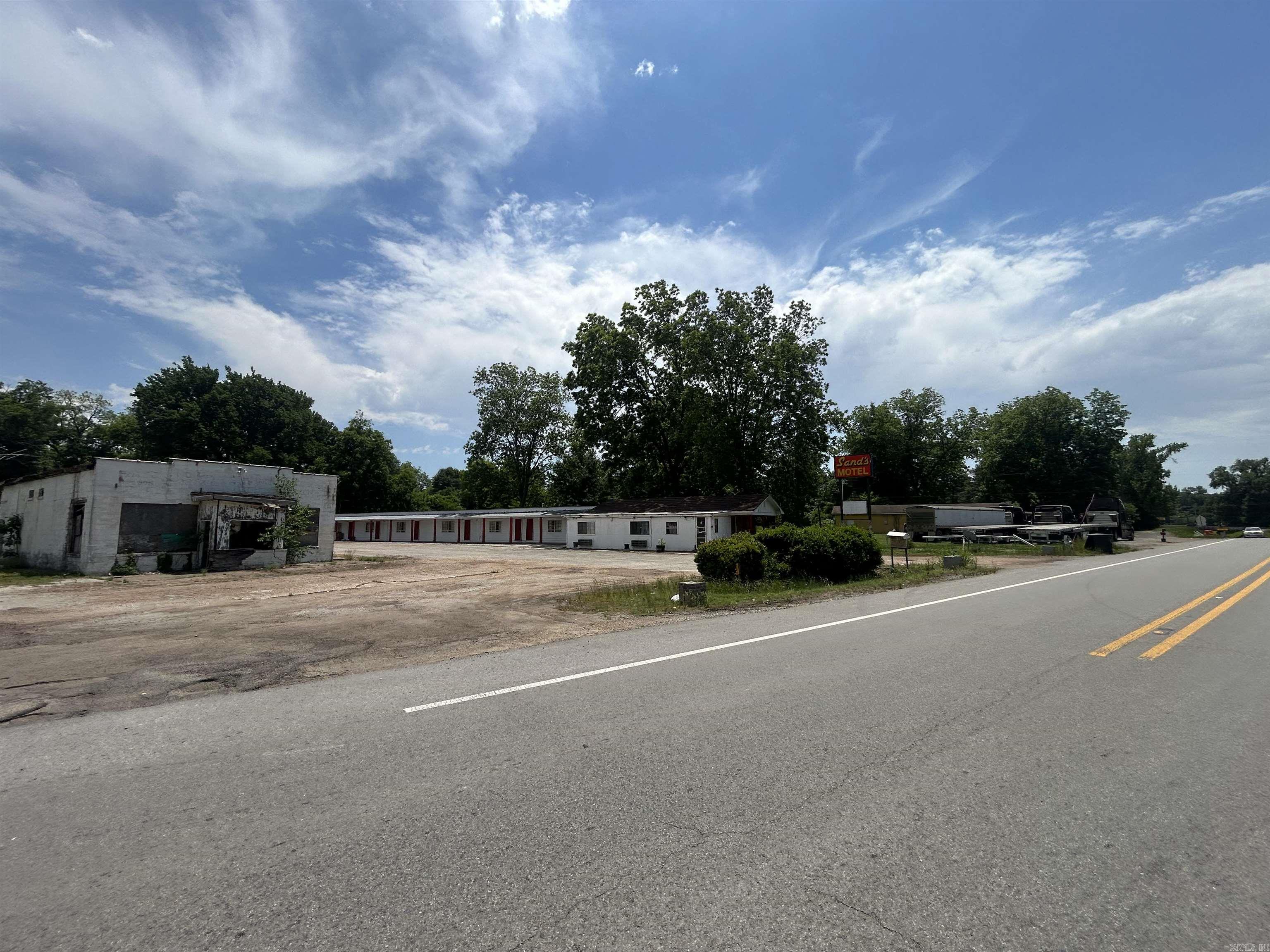 Investment opportunity! This commercial property along HWY 79 in Marianna, AR boast opportunity for your portfolio. Once home to “Sands Motel”, the facility is now ready for you to bring new life. With 16 individual rooms, an office and additional space, possibilities are endless. Whether it be a full rehab as a motel or apartments, lodging for a private hunting club, or even demolition for new development, this commercial property offers a plethora of options to grow a business along Highway 79!
