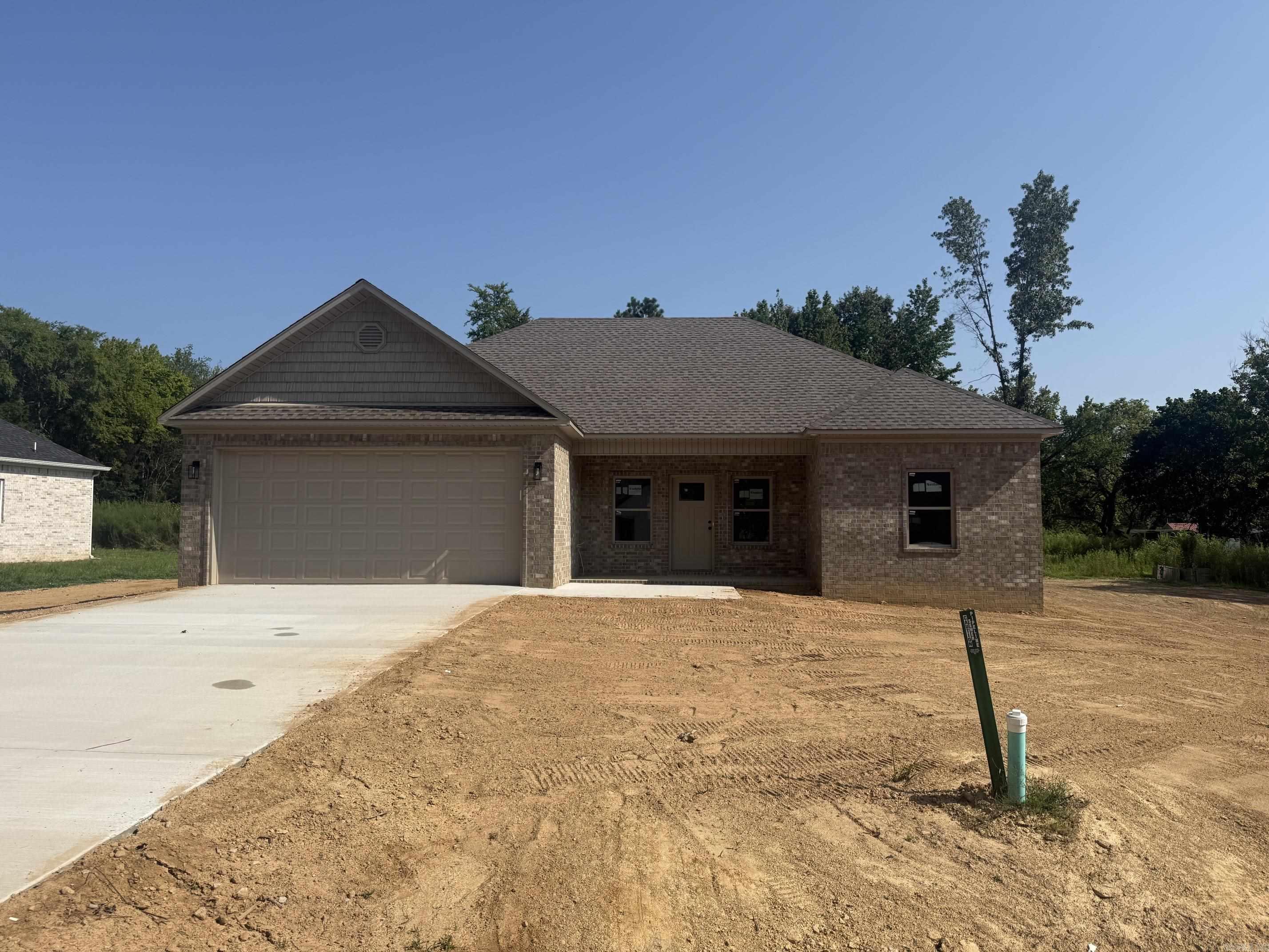 Brand new construction offering modern style and quality craftsmanship! This thoughtfully designed home features an open-concept layout with spacious living and dining areas, perfect for entertaining. Vaulted ceilings and abundant natural light will create a bright, airy feel once completed. The split-bedroom floor plan provides privacy, with a generous primary suite expected to include a well-appointed bath and walk-in closet. The kitchen is planned to be the heart of the home, with ample cabinetry, modern finishes, and a functional layout ideal for everyday living. Framing is already in place, giving buyers a great opportunity to envision the finished product—and possibly select certain finishes depending on build stage at contract. Exterior will feature attractive curb appeal with a covered front entry and attached garage. Situated on a roomy lot, there’s plenty of space to enjoy outdoor living. Don’t miss your chance to own a beautiful new home with contemporary design and quality construction!