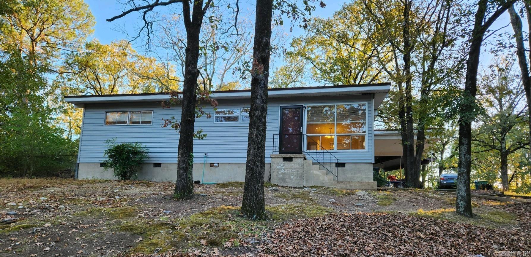 Lovely Updated Home in Great SW LR location! Refreshed & Ready to Tour! 3 Bedrooms, 1 1/2 Bathrooms. All Hard Surface Floors - No Carpet! Open Kitchen w/ Eat-In/Dining Area.  Spacious Great Room.   Carport and Parking Pad.  Large Lot w/ Fenced-In Back Yard