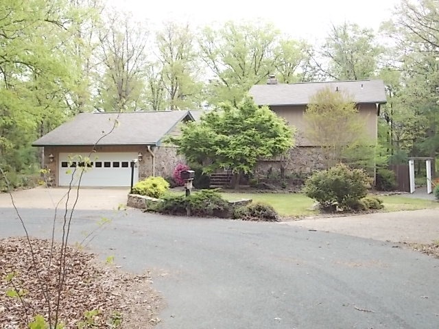 Call today to see this lovely home with lots of space.  Located on Indian Hills golf course.  Open kitchen, natural stone fireplace, great sunroom, detached 2 car garage plus shop.  Seller has directed that all offers be made using HomePath online offer system at www.homepath.com. Fannie Mae Purchase Addendum is Required with All offers. Owner Occ Cert. Required with all Owner Occ Offers.