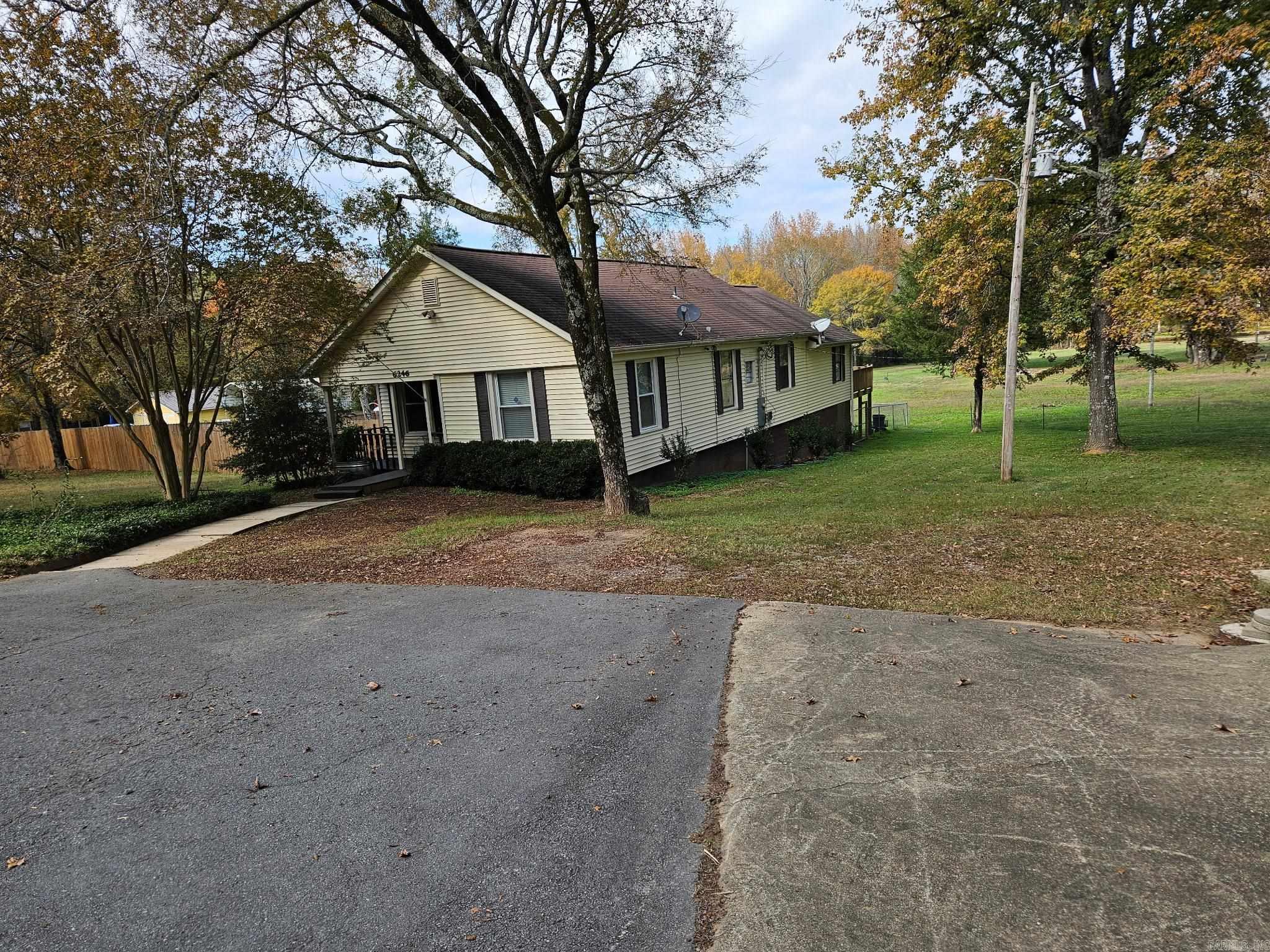 Quaint rustic farmhouse on just under 5 beautiful acres. Large mature trees but mostly fenced pasture, stocked pond at the back of the property. Large detached carport that is tall enough for an RV. So much character in this home. New remodeled bathrooms, a large master with a sitting area, a huge walk-in closet, and an exterior door to a deck overlooking the property. On a dead-end road with very little traffic, private but only a few minutes to the back gate of LRAFB.