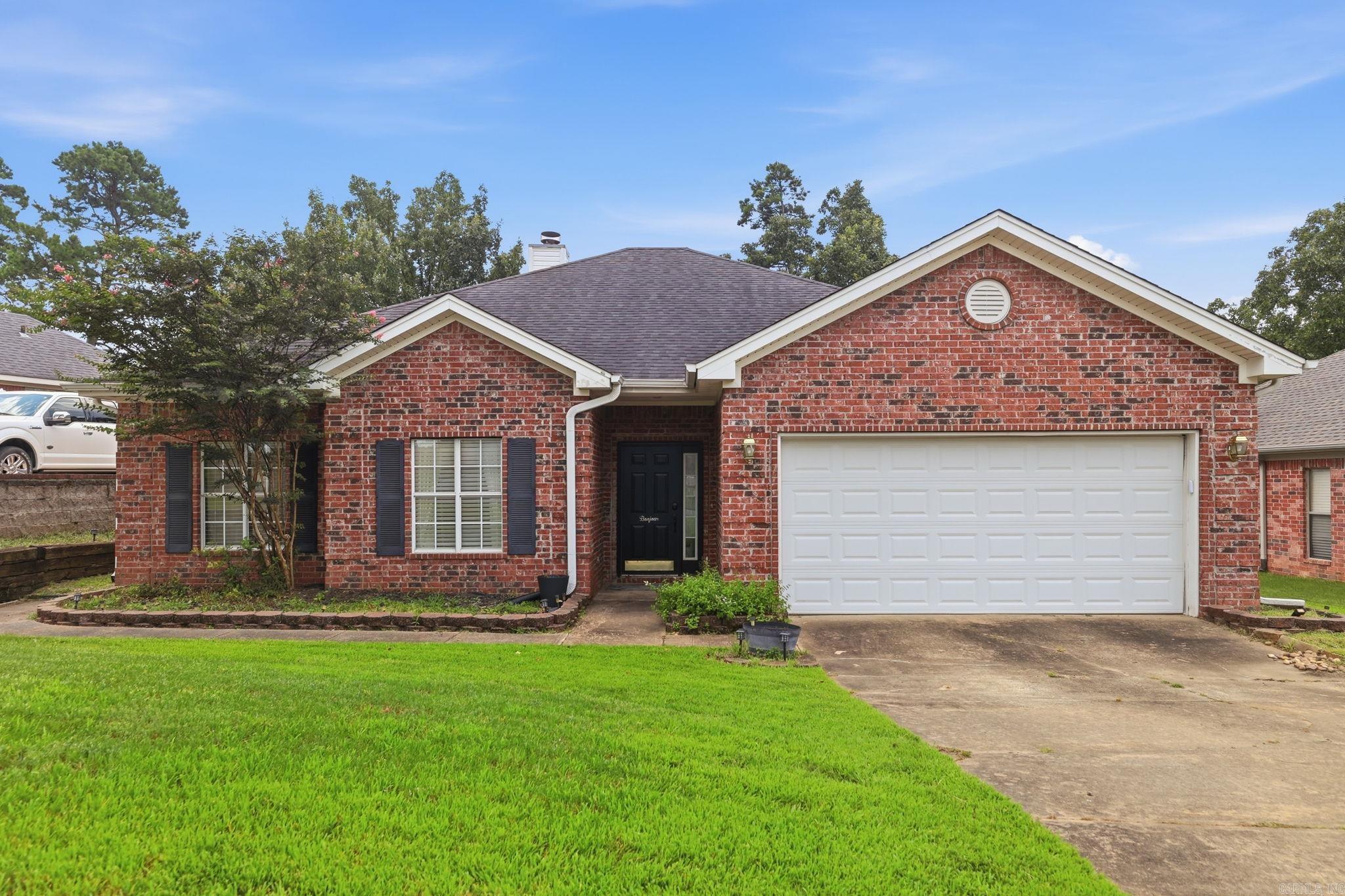 Some homes just make sense — this single-level, move in ready home is one of them. No stairs, no wasted space, just an easy layout built for everyday life. Step into the foyer and find the open living area with large separate dining room (currently a fun play room). Well maintained hardwoods flow throughout the home with tile in the kitchen and bathrooms. Two guest bedrooms offer natural light and large walk in closets. The spacious primary suite, split from the guest bedrooms, is private and features two closets, double vanities, jetted tub and separate shower. The open kitchen with updated appliances (2023) offers a pantry, granite countertops, gas range and a charming breakfast area. Outside, a fully fenced backyard offers privacy and room to breathe, while the covered patio overlooks a beautiful backyard — perfect for relaxing afternoons. Fire up the grill on the dedicated grill pad and let the view do the rest. Best part? Big-ticket items are already handled: new AC (2023), new water heater (2023), new gutters (2023), and leaf guards (2023). The 2 car garage plus storage keeps the house decluttered and easy to live in. Make it yours today! *Dining room virtually staged.