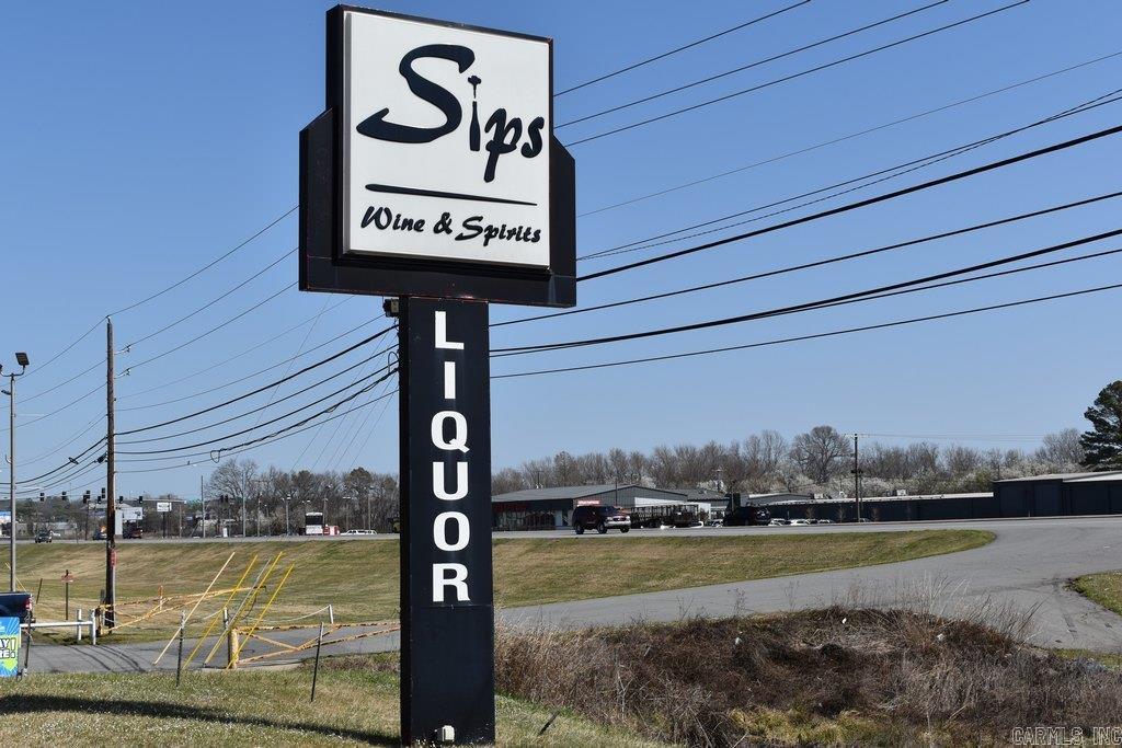 Beautifully renovated and thoughtfully designed liquor store building offering an inviting atmosphere and a well-established clientele. This 4,300+ SF building with land is ideally located in a high-traffic, high-visibility area on S. University Ave., just off the I-30 exit, offering excellent access and exposure. The business is currently operating with positive income and has strong potential for expansion into a larger-scale, higher-profit operation. Zoned C-4 Commercial, the property allows a wide range of uses including office, restaurants, and entertainment to be added to the liquor business. Situated on approximately 2.25 acres, the fully paved lot provides 50+ parking spaces and currently hosting multiple food vendors, creating immediate rental income while increasing overall foot traffic. Additional features include a convenient drive-through window, large walk-in cooler extending behind all display cooler units for efficient loading, private office, coffee room, and abundant storage space. The sale of the property must include the liquor permit sale at an additional $180K to be collected at closing. *Seller may sell the liquor permit alone prior to the property sale.