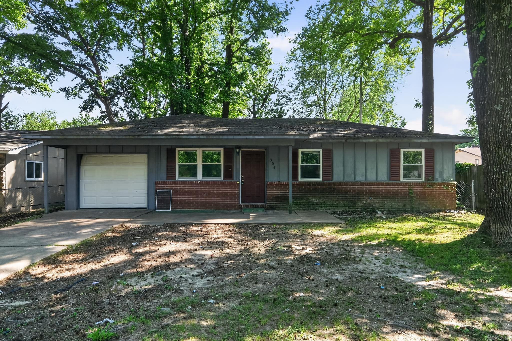 Charming 3-bedroom, 1.5-bath home in a quiet Jacksonville neighborhood, with 1,196 sq ft of comfortable living space. This brick and vinyl property features a functional layout with a spacious living area, a bright kitchen with ample cabinet storage, and a cozy dining space perfect for everyday living. The primary suite includes a private half bath, while two additional bedrooms provide flexibility and comfort. A bonus 11x10 sitting room off the kitchen area provides a welcoming space to relax and gather. Outside, an attached garage provides convenient parking while a manageable yard with mature trees provides a platform for outdoor enjoyment. Conveniently located near schools, shopping, and local amenities.