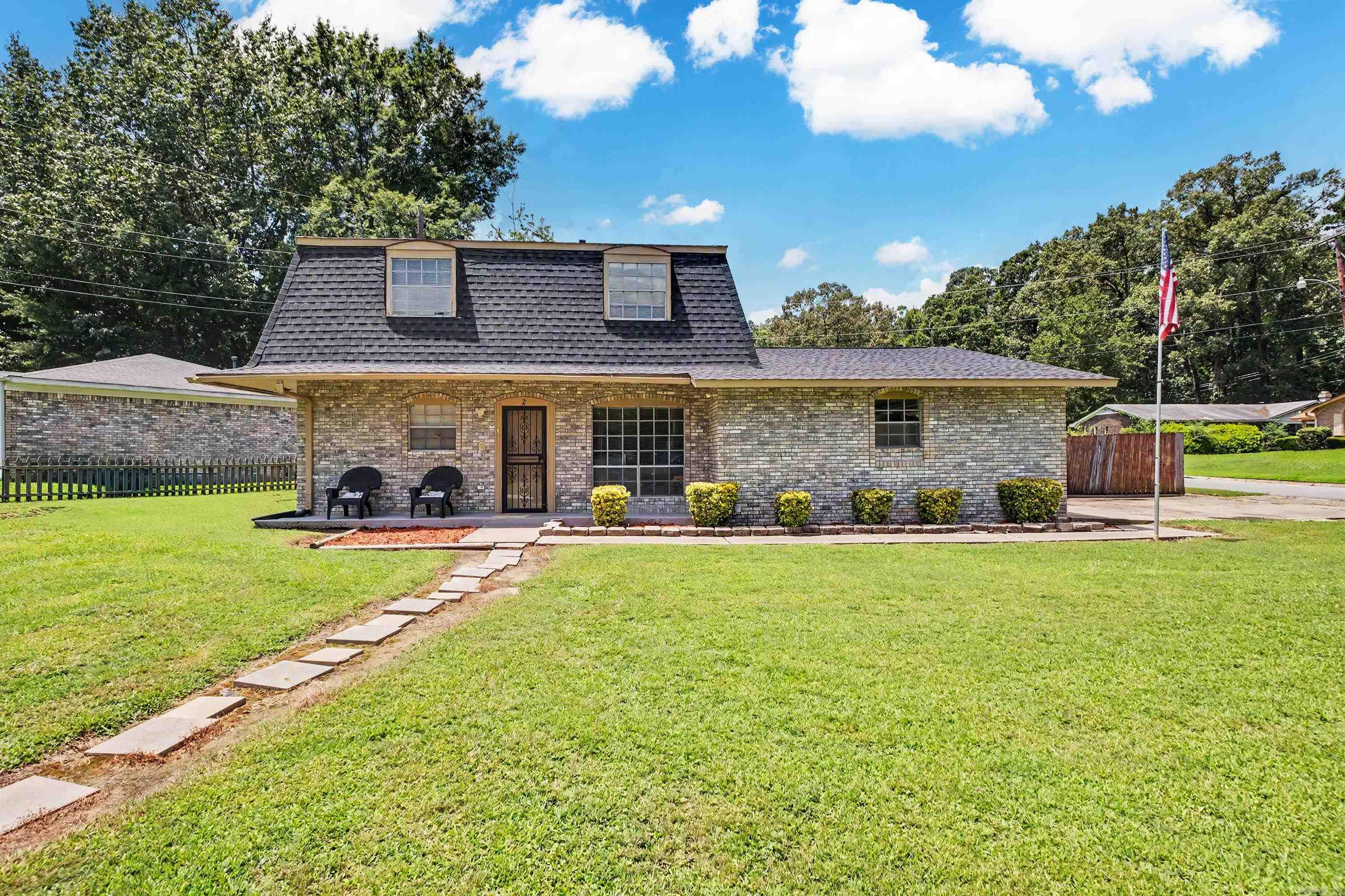 This all-brick home on a corner lot offers 4 bedrooms, 2 bathrooms, and a layout designed for everyday living. Durable tile flooring throughout the main living areas makes clean-up a breeze, while the bedrooms offer the comfort of carpet. The separate dining room is currently being used as a home office but could easily serve as a formal dining space, second living area, or flex room to fit your needs. The primary bedroom is conveniently located on the main level, with three additional bedrooms and a full bathroom upstairs. Step outside to enjoy the large, fenced backyard, perfect for relaxing, entertaining, or letting pets play. The roof was replaced in 2023. Conveniently located near parks, the community center, shopping, restaurants, and entertainment, this home is ready for its next owner.