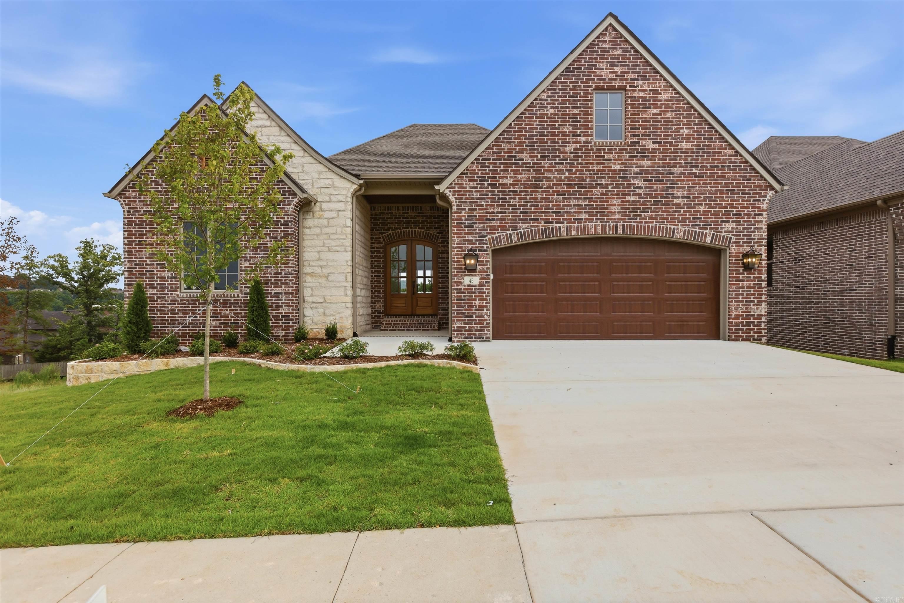 This is a beautiful brand new plan specially designed for the Mountain Brook community, ready for you to make it your own! Builder is offering a $5,000 customization credit with an acceptable offer!!   Entering on the main level, you're greeted by an open foyer with 12' ceilings. There are 3 bedrooms on this level, including the primary suite! The en-suite primary bathroom feels like an oasis with an enormous walk in shower, free standing tub, and double vanities. This bathroom connects to a giant walk in closet, which leads into to the highly functional laundry room for ease in every day living. The living area is open with spacious kitchen and dedicated dining area, and it features a covered porch offering top-of-the-hill views.   Downstairs you'll find a secondary living area. There is a 4th bedroom, a full bathroom, and a large flex room that accesses the massive crawl space! The crawl space is also accessible from the side of the home. Perfect for storage, or a workshop!   Mountain Brook offers scenic views and a highly convenient location in West Little Rock. This home is move-in ready, and ready for you to decide on finishing touches!