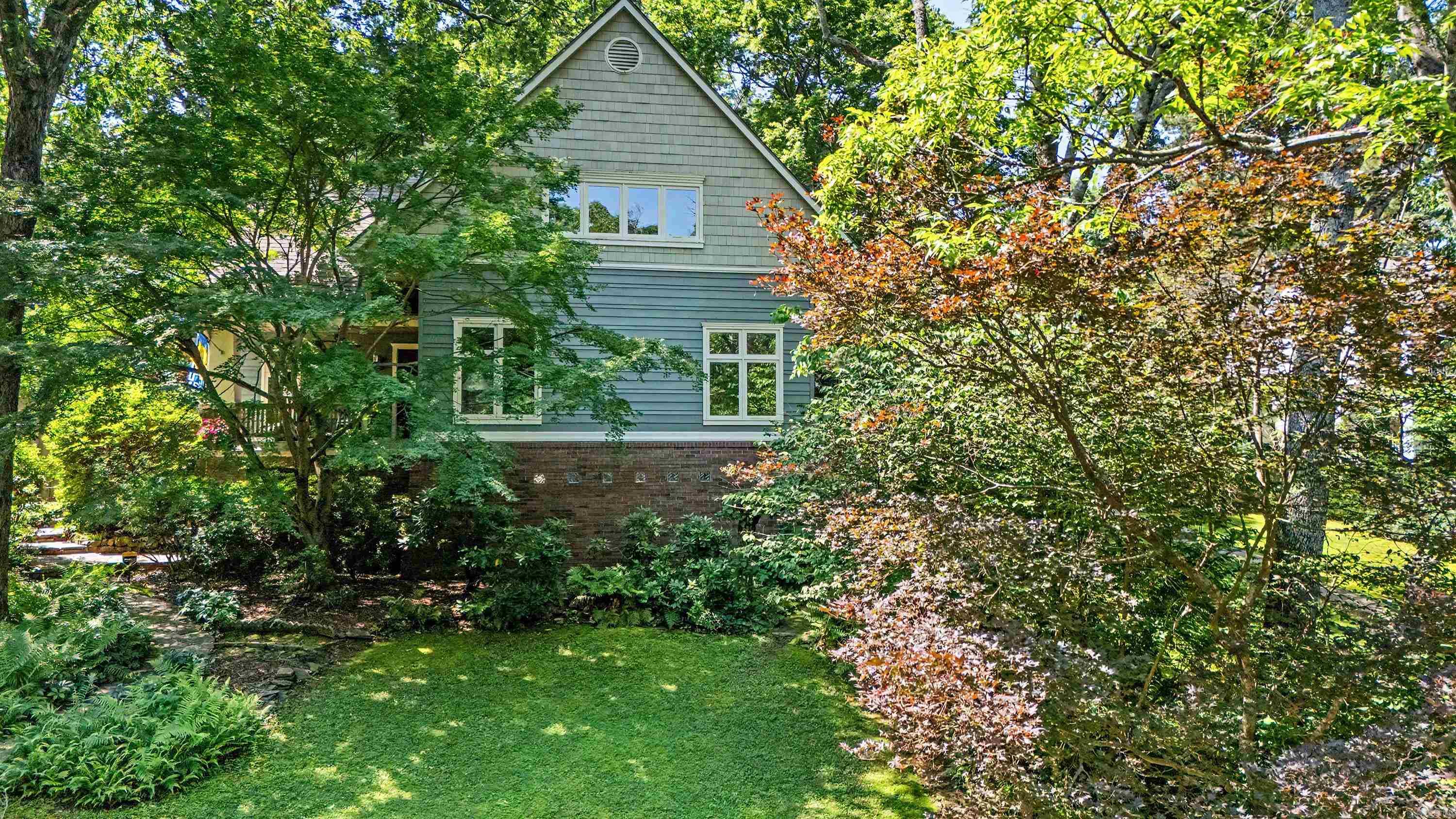 Tucked away just off Allsopp Park, 3905 N Lookout is one of those homes that feels like a quiet retreat while still keeping you close to everything. This 2,950 sq ft home offers living spaces on the main level, bedrooms upstairs, and a finished room downstairs (plumbing ready) — perfect for a flex space, guest area, or hangout zone. With 4 bedrooms and 2.5 baths total, there’s room to spread out without losing that cozy feel. Natural light pours in throughout the home, and the front porch is an ideal spot for morning coffee or a good book. The living room fireplace anchors the main space, while the backyard outdoor fireplace sets the scene for relaxed evenings outside. The primary bedroom overlooks the park and includes a heated floor in the en-suite bath. Quiet, peaceful, and tucked into a beautiful area with quick access to multiple parts of town, this location truly delivers the best of both worlds.