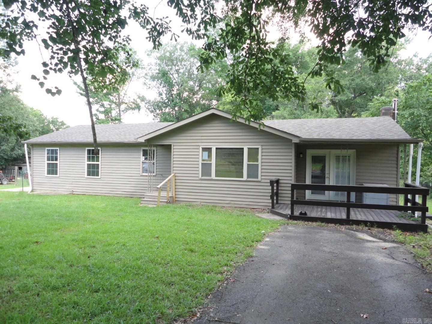 This cute and spacious home has 2 bedrooms, 1 bath, with multiple living areas, one could easily by used as 3rd bedroom.  Nice sized kitchen/dining combo, den with wood burning stove, exterior has decks on front and back, small ‘pavilion’ in back yard and storm shelter, all on approximately 1.5 acre lot.  HUD Owned Property, Case #031-597566, agents please READ confidential remarks for showing instructions and offer submission information.