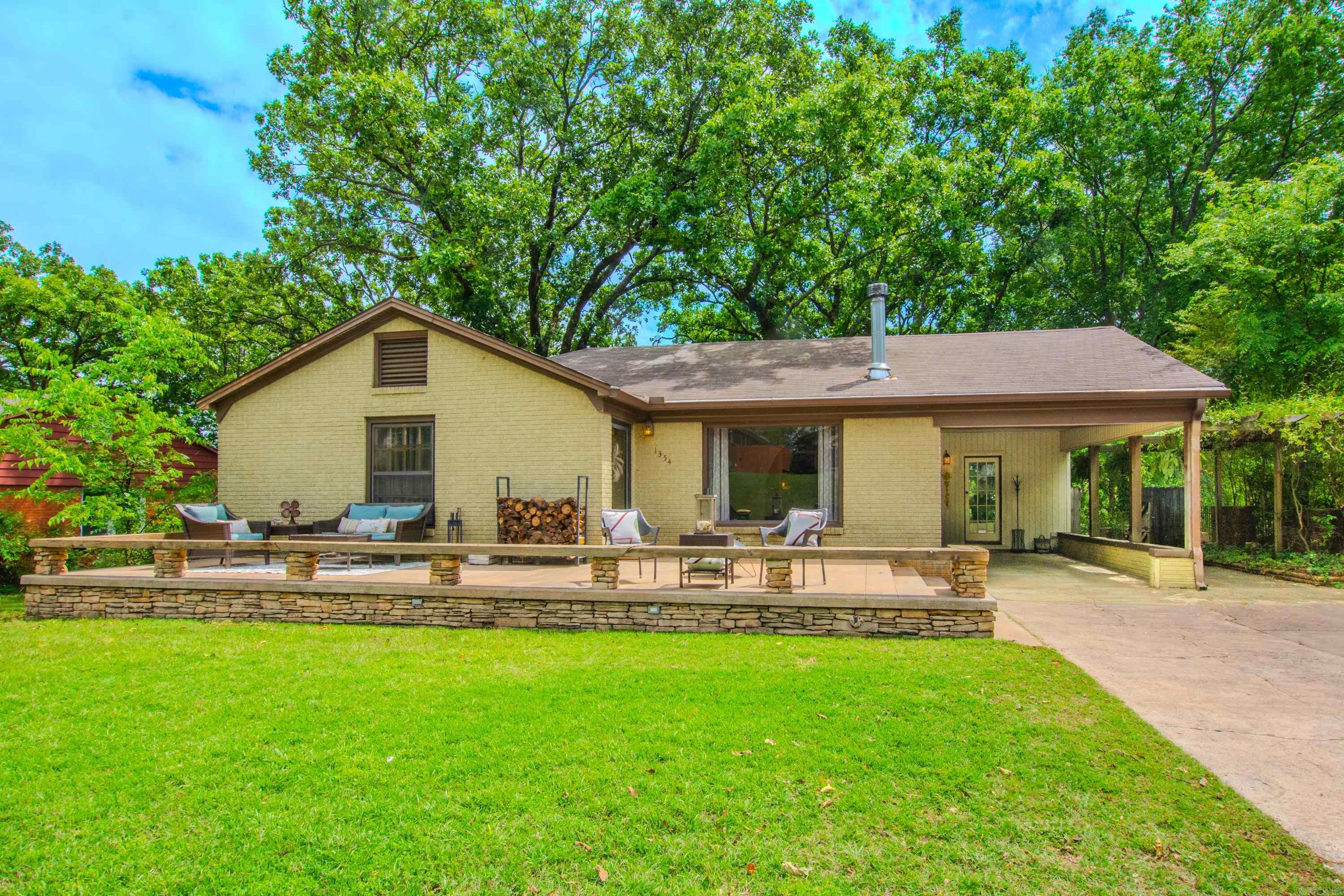 This wonderful Park Hill home offers comfortable living inside & out! 2 bedrooms, 2 baths plus a bonus room (offering flexibility for an office, a nursery or extra living space). Upon entering the living room appreciate the curved archways, the natural light streaming through the large picture windows, the beauty of hardwood floors, and an inviting dining area. The updated kitchen features granite countertops, a hammered copper sink, and solid oak cabinets nestled between a cozy sunroom/ breakfast area and the entrance to a large laundry/mudroom. The expansive front porch or the extra-large rear deck overlooking the over ½ acre lot, offers a great space for outdoor entertaining and/or activities. There’s also an approx. 10’x16’ storage shed/shop with electricity in the fully fenced backyard.