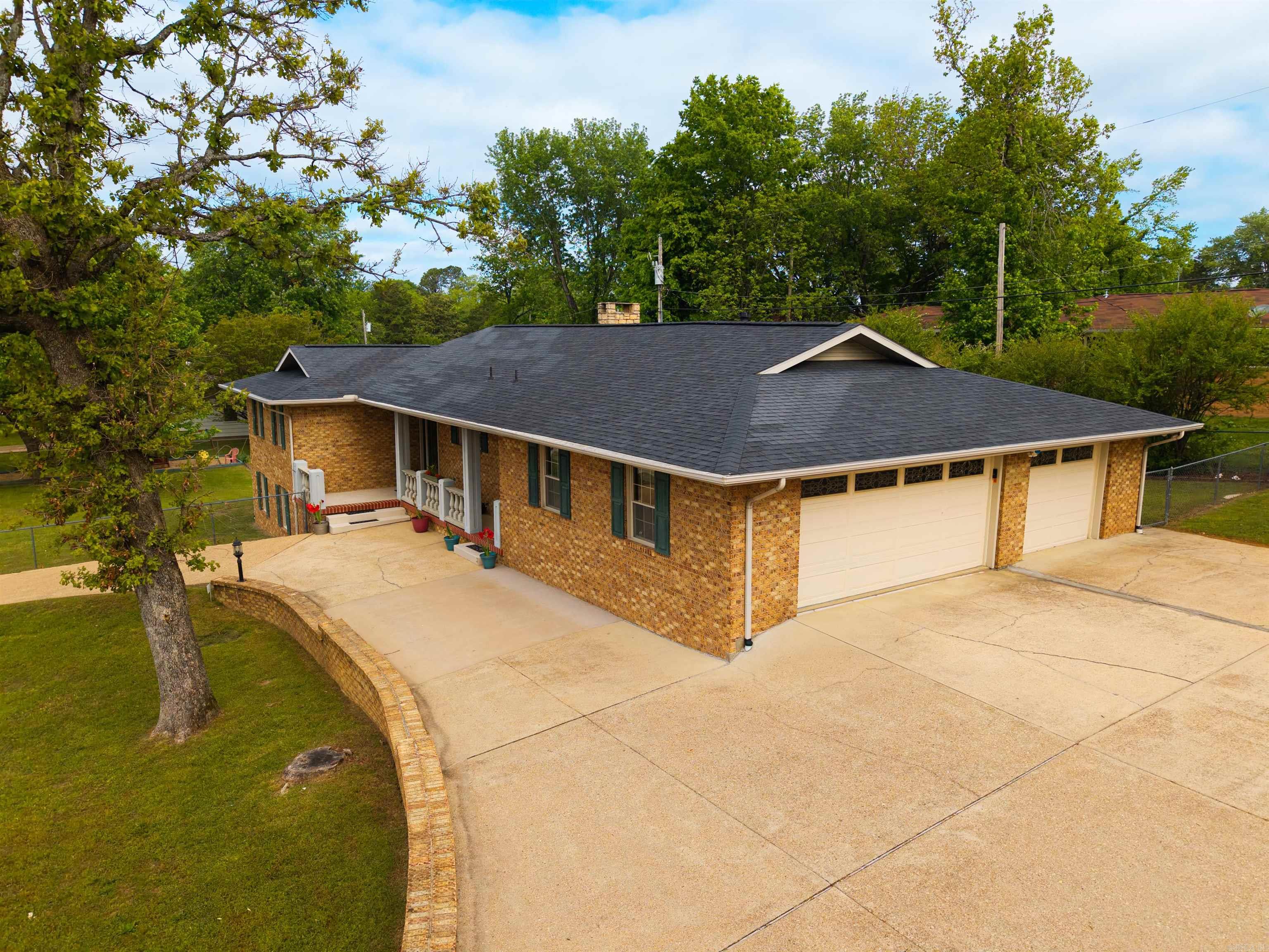 This spacious 3-bedroom, 3-bathroom property offers two separate living areas, a generously sized kitchen, complete with a butler’s pantry that adds extra prep space and storage, plus a dining area. The walk-out basement provides even more flexibility, whether you envision a guest suite, recreation area, or private retreat. One of the stand-out features is the large fenced yard with garden shed spanning two lots, offering possibilities for outdoor entertaining, gardening, pets, or recreation.  The 3-car garage adds storage possibilities and the large paved area and circle drive provide convenience and ample parking.
