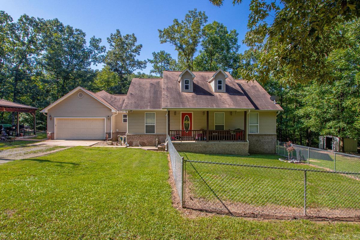 Nestled on a private, tree-covered lot in the gated Riverview Subdivision, this inviting home offers the perfect blend of comfort, nature, and convenience. Enjoy an open floor plan featuring granite countertops, breakfast bars on both ends of the kitchen, a dedicated breakfast area, separate dining space, and all kitchen appliances conveying. Stay comfortable year-round with central heat and air plus a cozy wood-burning stove for supplemental heat. A new HVAC system (inside and out) was installed in 2025.  Outdoor living is a dream with a spacious covered patio complete with electrical outlets and ceiling fans, making it ideal for entertaining, along with a large deck overlooking the peaceful, wooded backyard. Rolling Brook Creek borders the bottom of the property, where abundant wildlife and mature trees create a serene retreat.  Need extra workspace? The detached shop includes an attached office with hookups already in place for a mini-split heating and cooling unit.  Located just moments from the Ouachita River, this gated community is minutes from I-30, approximately 20 minutes to Hot Springs National Park, offering the perfect balance of privacy and accessibility.