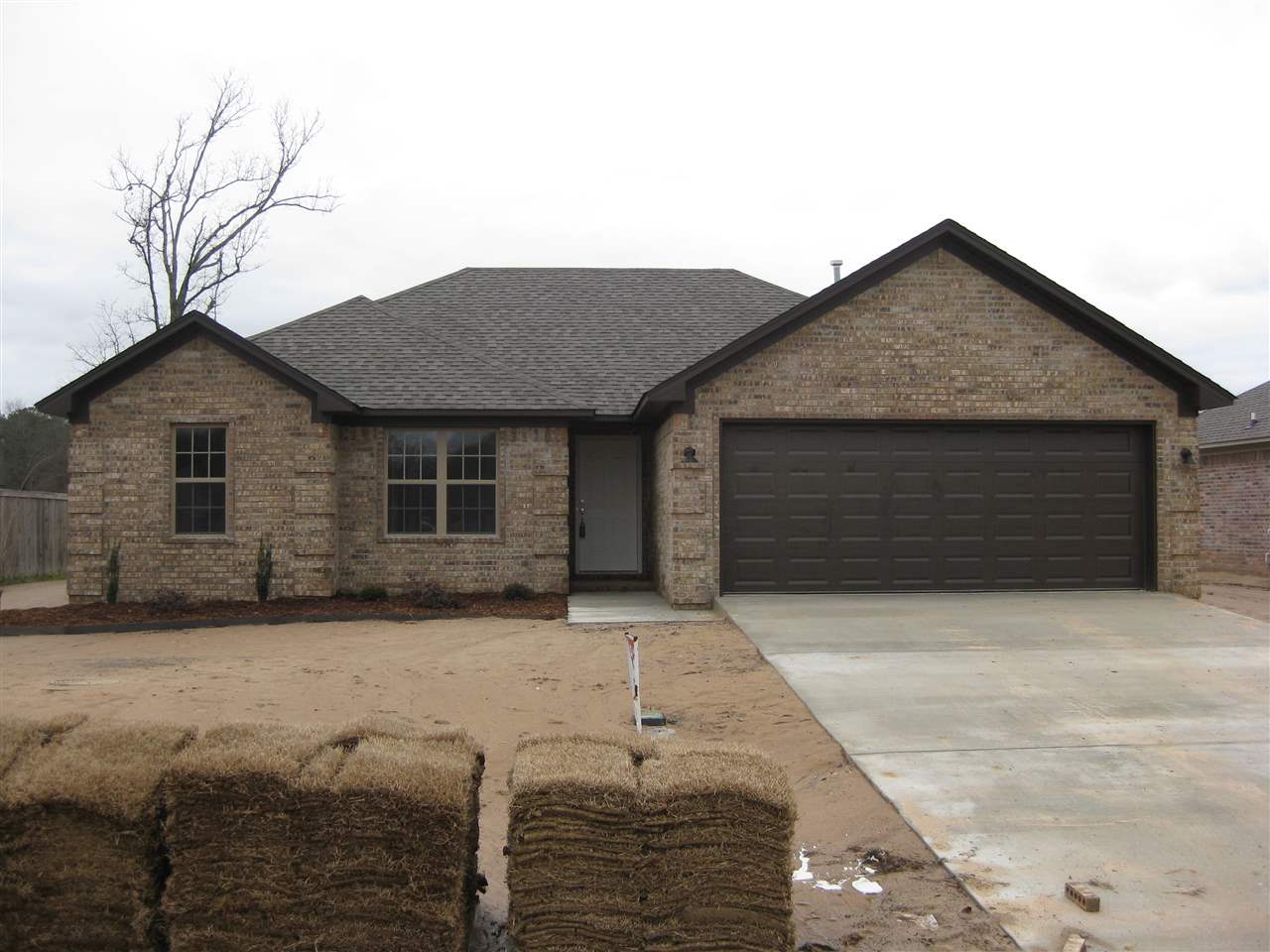 Super starter home or excellent for downsizing.  All brick home with fireplace, patio, stained floors, granite countertop in kitchen, custom cabinets and architechtural shingles. ***