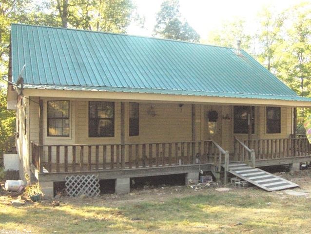No. 01372   Home and 1.12 acre near Fifty Six Arkansas for sale.  2032 square feet that still needs some finishing upstairs.  Downstairs has 2 bedrooms and 2 baths, a large kitchen and some great open beams in the great room.  Open concept floor plan with pine walls and wood floors.  Nice front porch.  Quiet country road setting.  The home is priced much below construction cost to allow for finishing and renovation.  Call today for an appointment.  $99,500