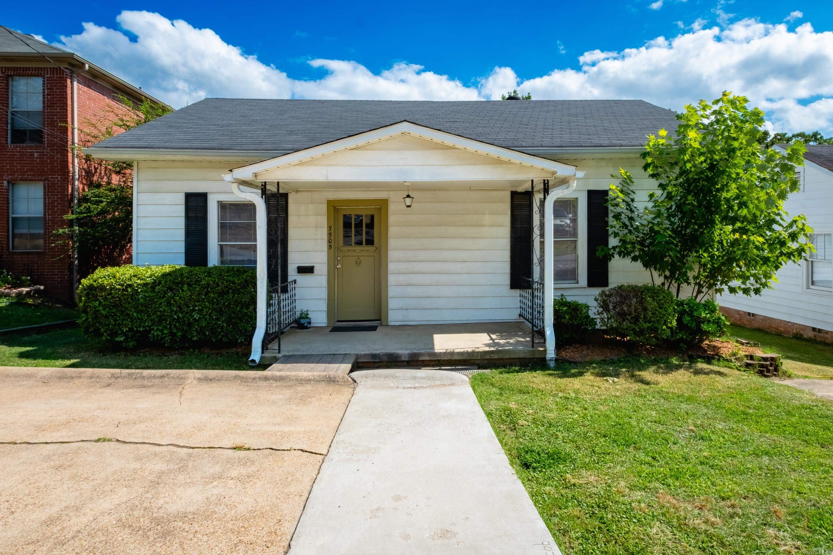 Versatile floorplan, great location, and move-in ready! This well-maintained home comes complete with solar panels and an above-ground pool featuring a Perma Salt system and pool pump. Featuring all new paint, granite countertops, door hardware, pool, and deck, this home offers both comfort and convenience. The 3rd bedroom has been converted into a utility room with washer and dryer. Enjoy two living areas that offer flexibility and can be used as a den, office, music room, or dining space, complete with floor-to-ceiling built-ins for extra storage. Beautiful hardwood floors, new mini blinds, and a tiled bathroom add to the charm. Enjoy minimal electric bills with energy-efficient solar panels. Additional features include a 220 charge point for an electric vehicle and 3 dedicated parking spaces. A unique home with flexible spaces and modern updates ready for its next owner! See agent remarks.