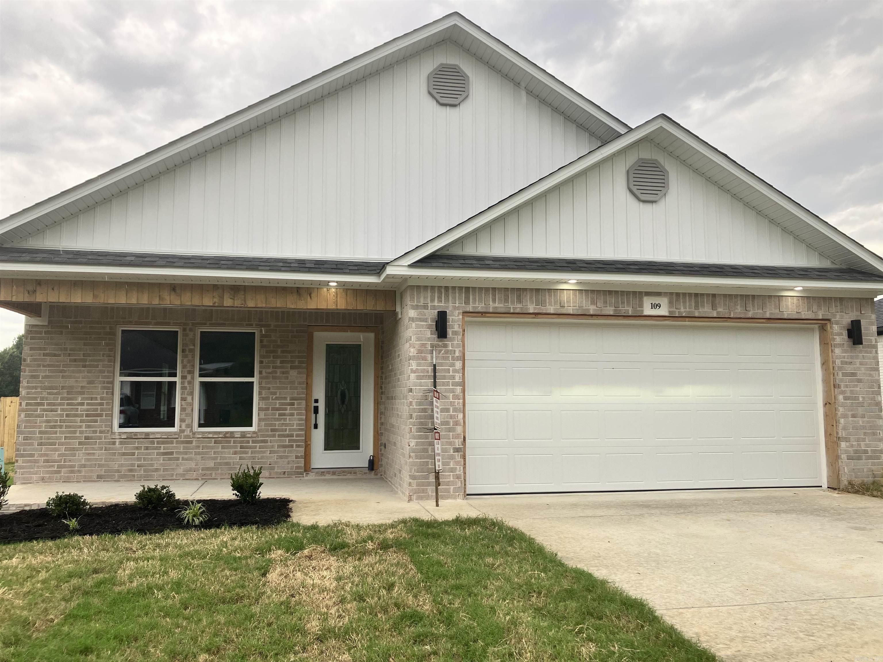 Get ready to love this brand-new 3-bedroom, 2-bath brick home with approximately 1,500 sq. ft. of stylish living space. Features include tilt-sash windows, full insulation, Wi-Fi thermostat, decked garage storage, exposed beams, wood crown details, quartz countertops, finished soft-close cabinetry, and a mobile kitchen island perfect for entertaining. The primary suite offers patio access, a spa-inspired bath with stand-alone tub, marble walk-in rainhead shower coupled with a handheld, double vanity, and spacious walk-in closet with a unique cubby feature. Additional storage where needed in the guest bed hallway, guest bath marble finishing. Enjoy a fully fenced backyard. Buyer booster package with washer, dryer, 65-inch TV, to compliment the traditional stove, refrigerator and dishwasher, $3,000 toward closing costs, and a seller-paid 2/10 builder’s warranty.