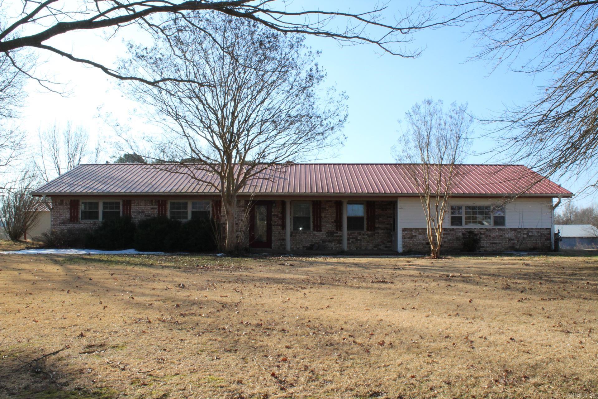 3 bed, 2 full baths with approx. 2607 Sq. Ft. of living space situated on approx. 16.58 acres with a shared pond.  Great kitchen with a large Island with range (Gas), Built-In oven & microwave, separate warming drawer, trash compactor, granite and lots of cabinets (refrigerator conveys).  Home has a formal living area and a family area with a massive brick wood burning fireplace with blower.  Central A/C & Heat. Home has metal roofing.  Home features a covered patio and a 18' round above ground pool and pool house.